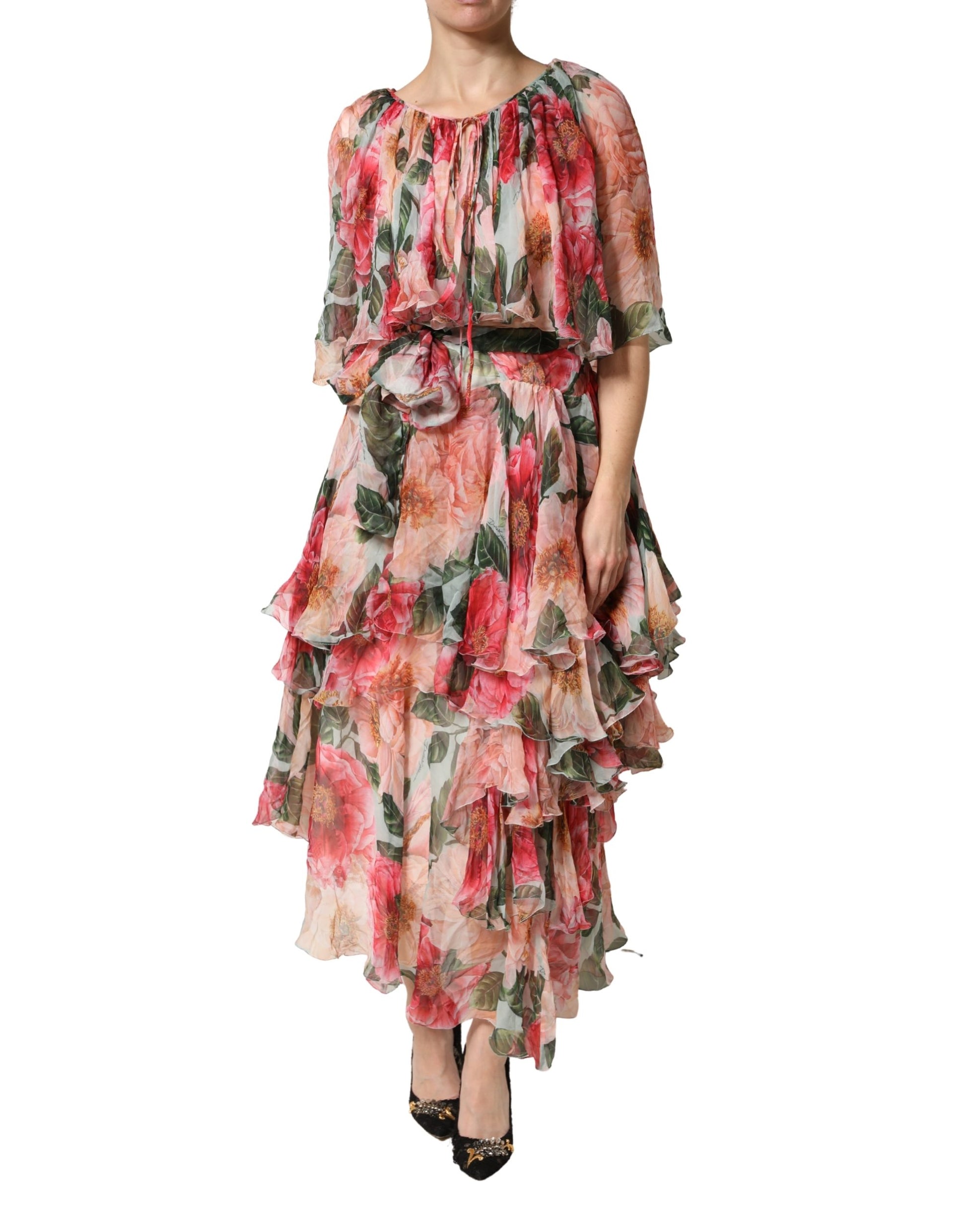 A woman wearing a multicolored floral silk layered maxi dress