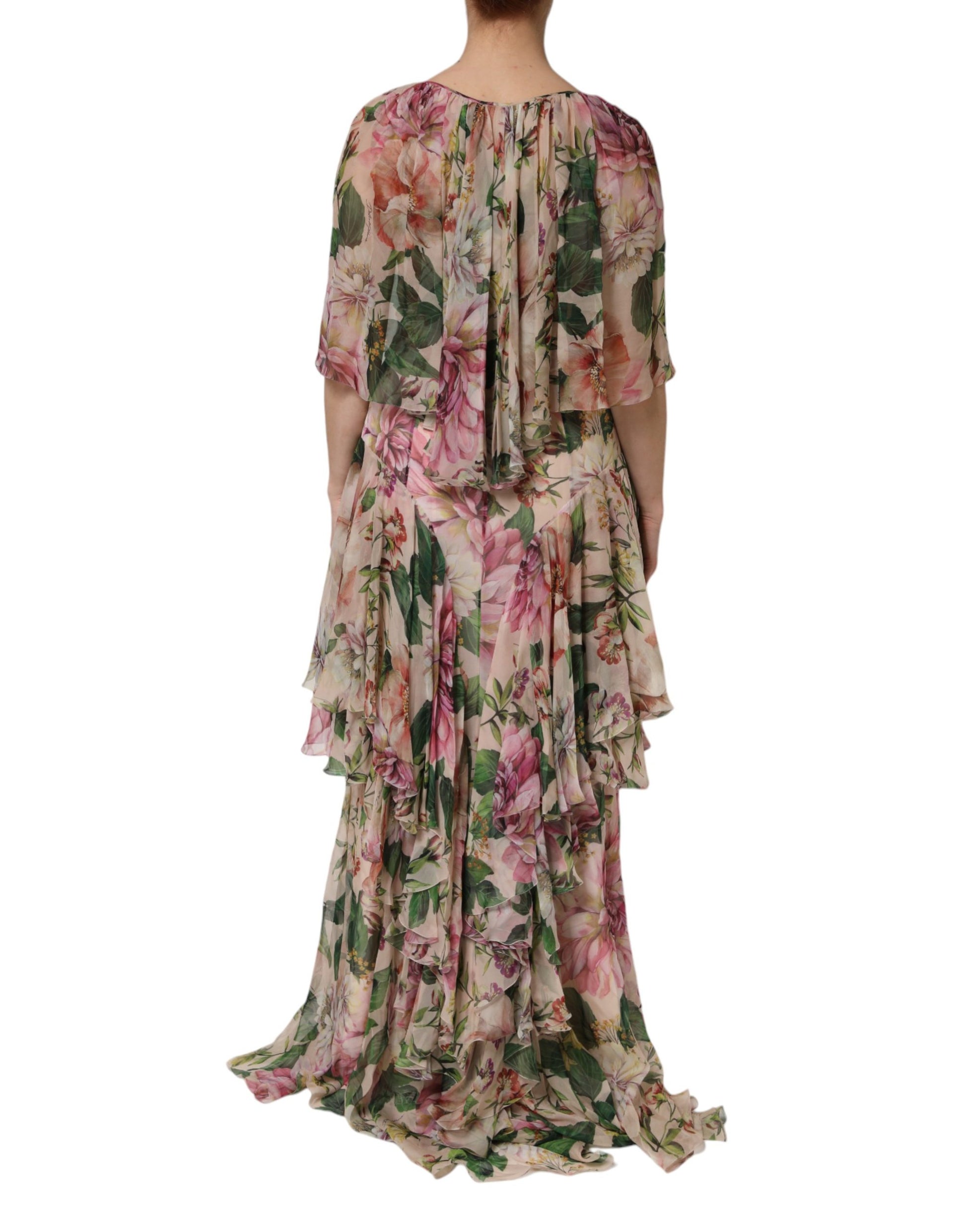 A long, layered maxi dress with a floral pattern in shades of pink and green