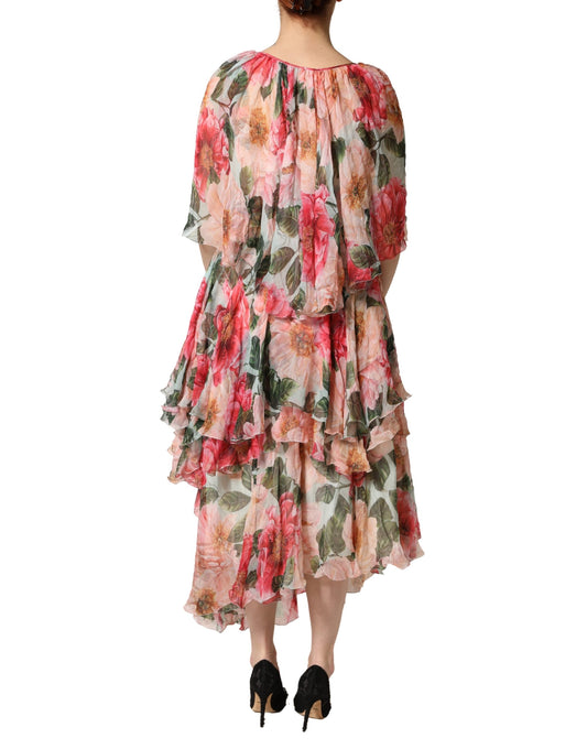 A long, layered maxi dress with a floral pattern and ruffled sleeves
