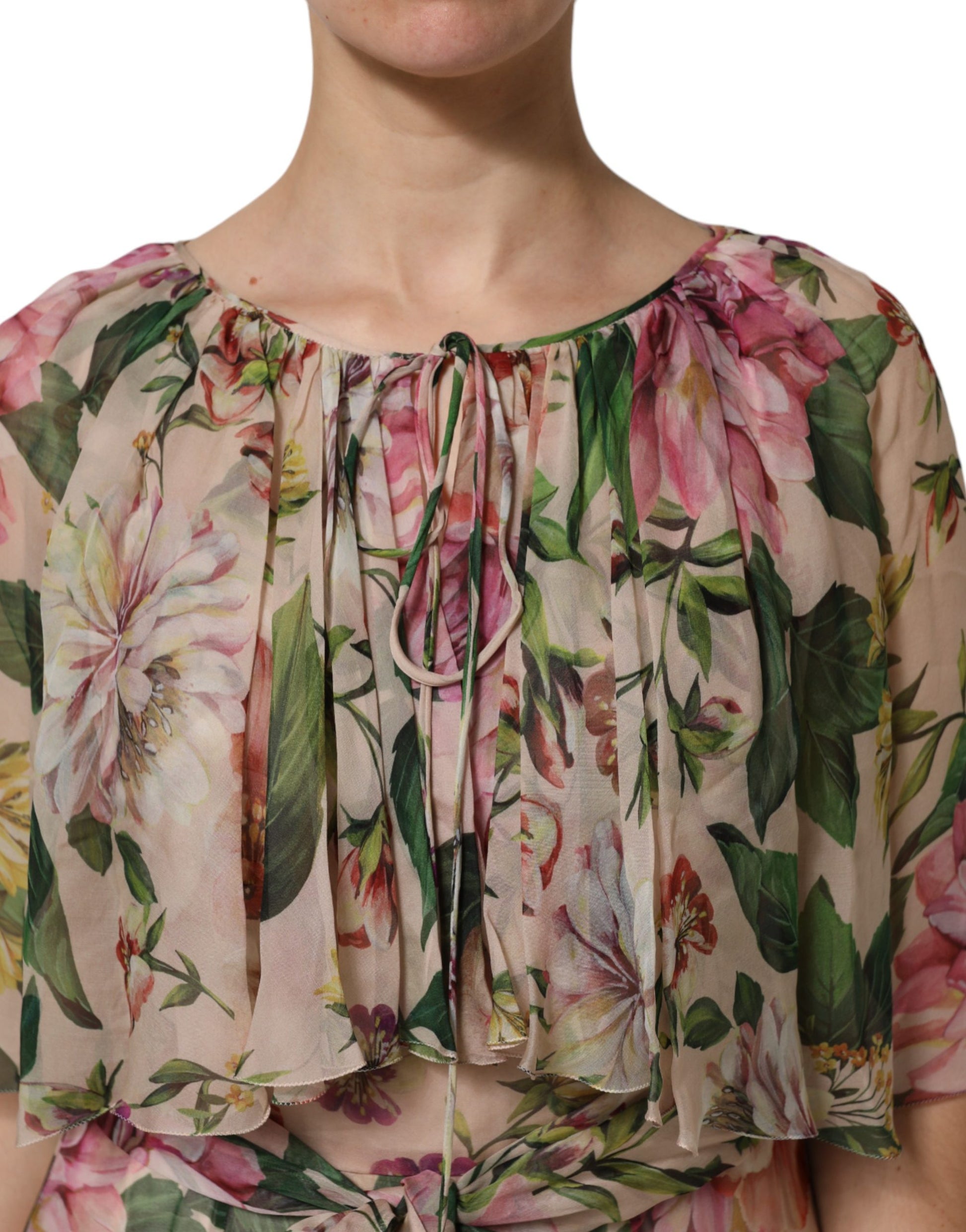 A woman wearing a multicolored floral silk layered maxi dress