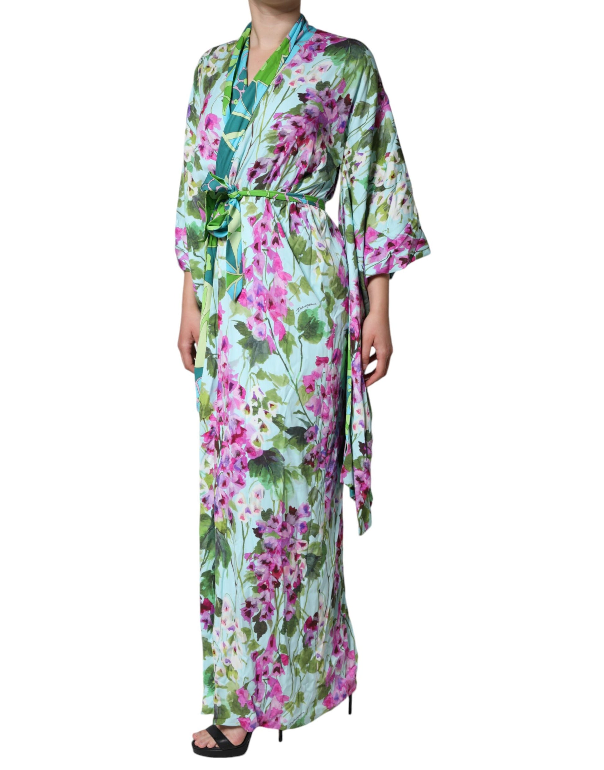A long, floral print silk wrap dress with a green and pink color scheme