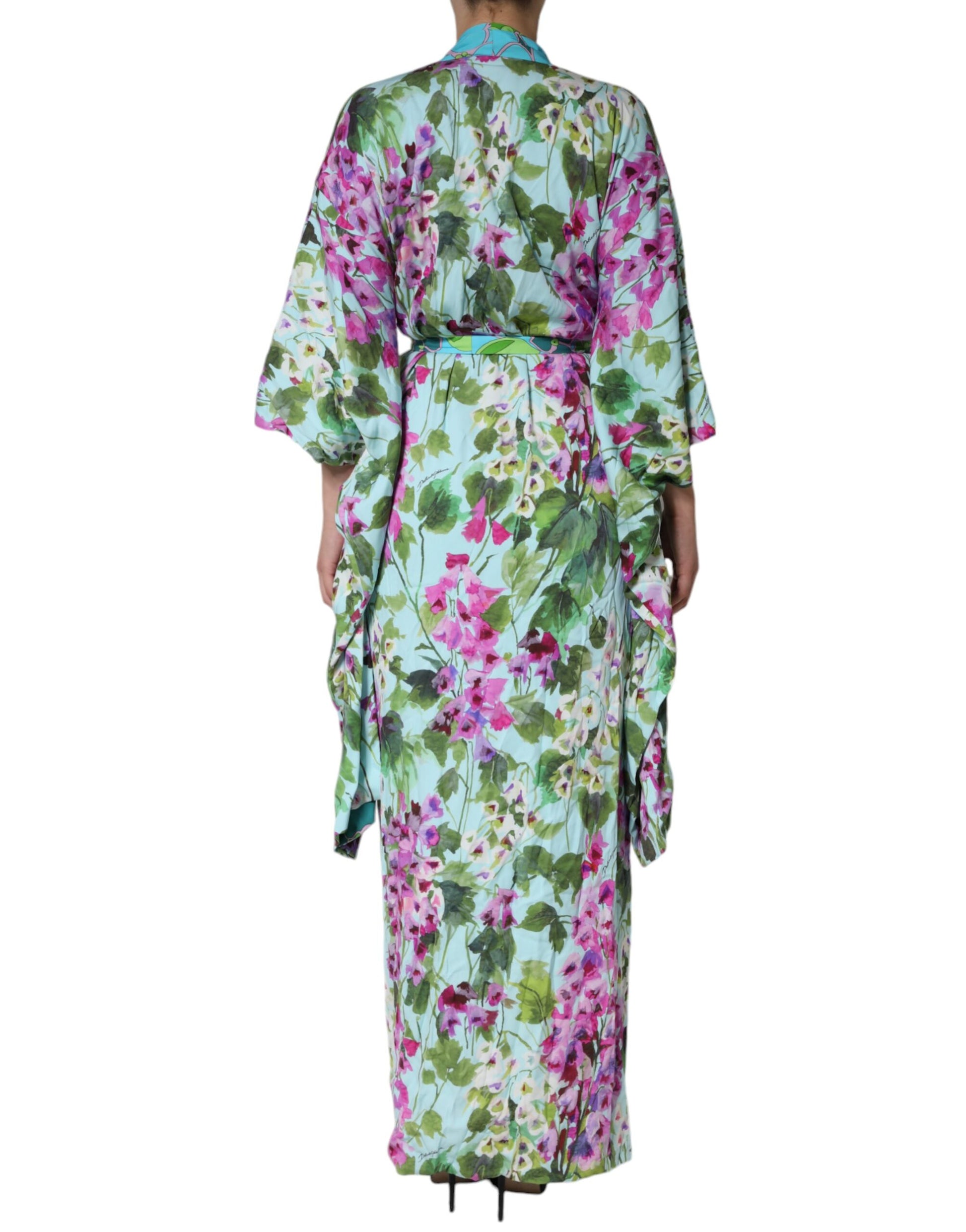 A woman's dress with a floral print and pink flowers, made of silk stretch fabric
