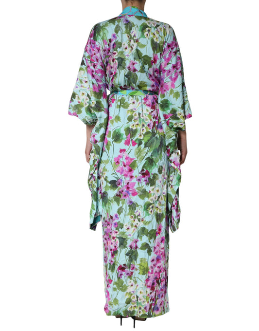 A woman's dress with a floral print and pink flowers, made of silk stretch fabric
