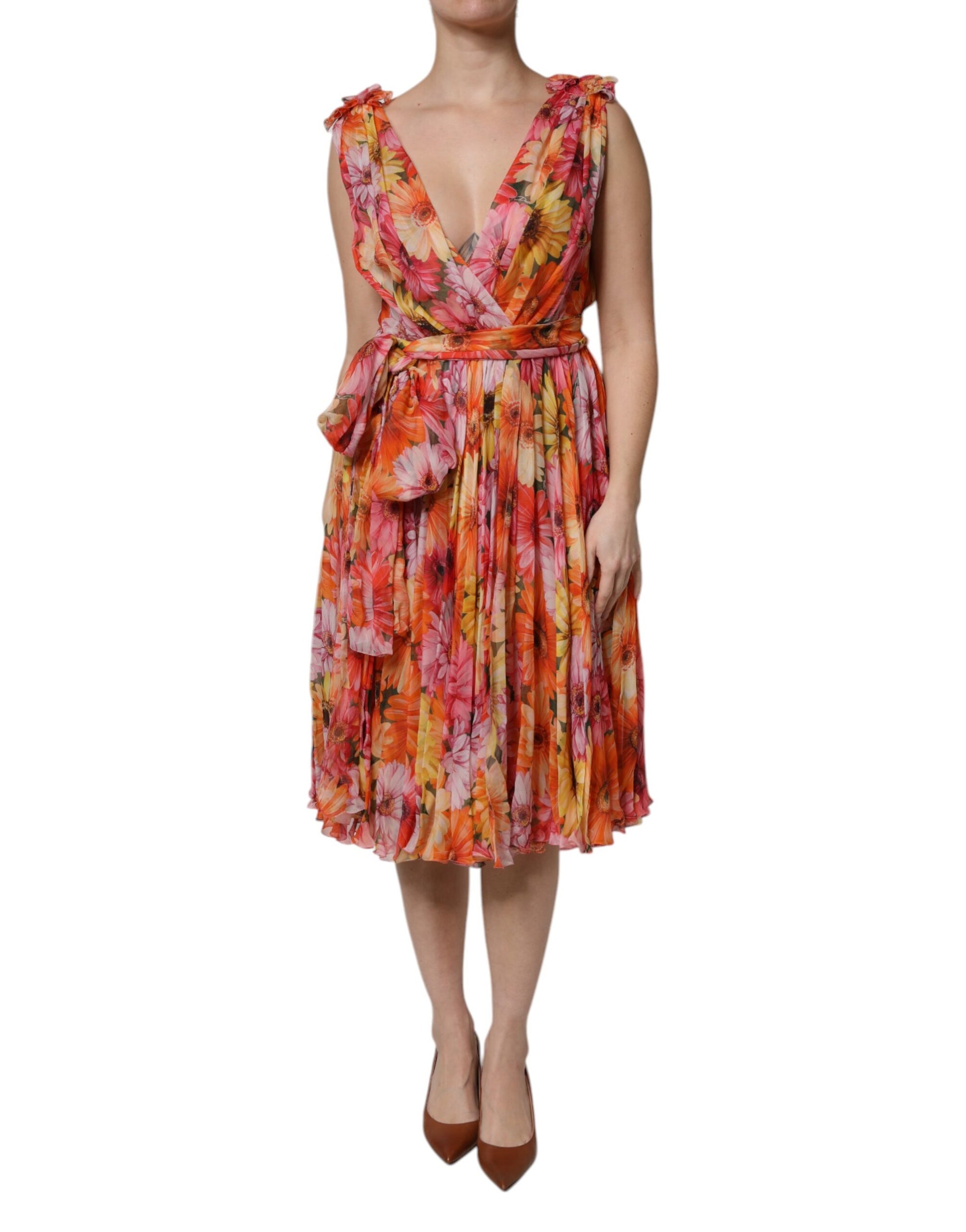 A woman wearing a multicolored floral chiffon dress with a V-neck