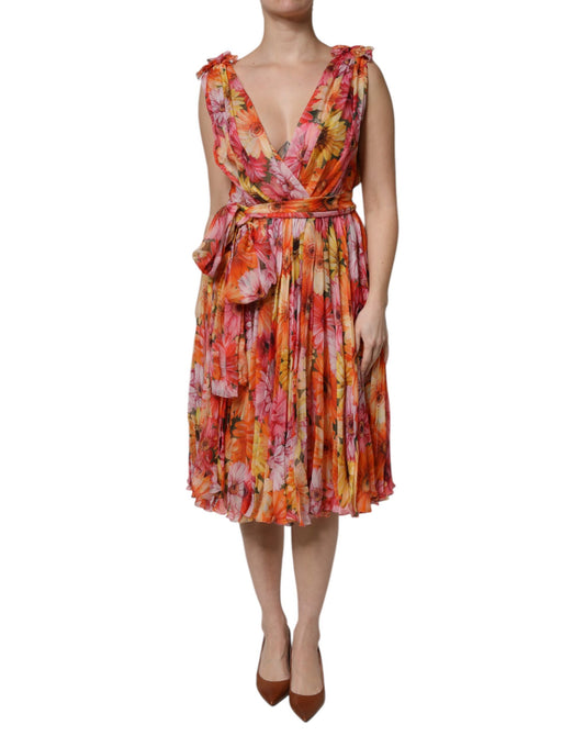 A woman wearing a multicolored floral chiffon dress with a V-neck