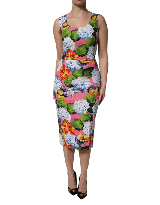 A sleeveless sheath dress with a floral pattern, featuring vibrant colors and a design that suggests it is from the brand Dol