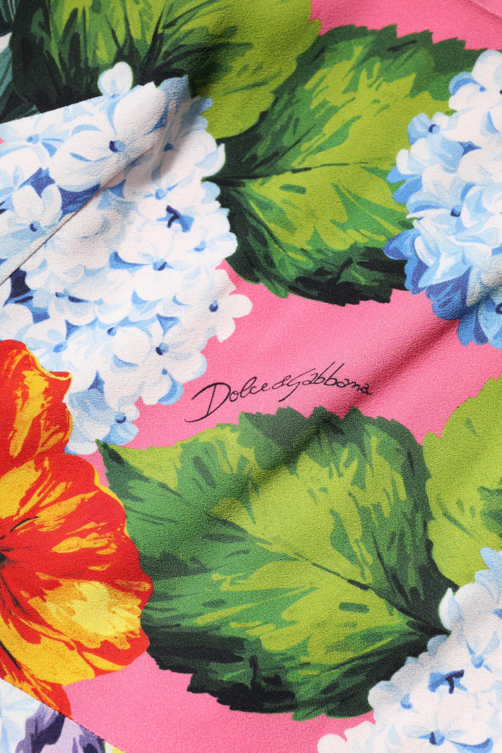 A colorful floral print sleeveless sheath dress by Dolce & Gabbana