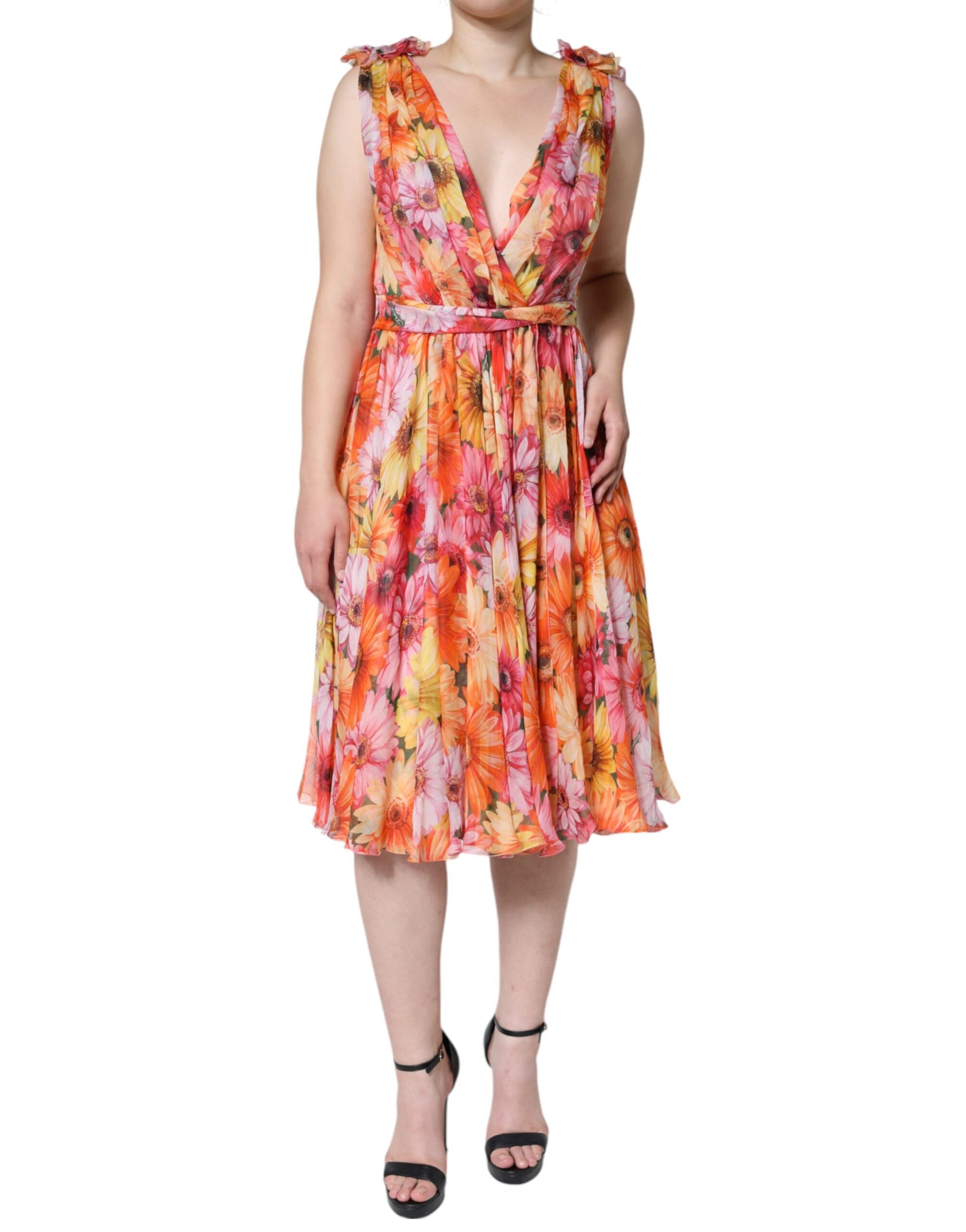 A sleeveless midi dress with a floral pattern