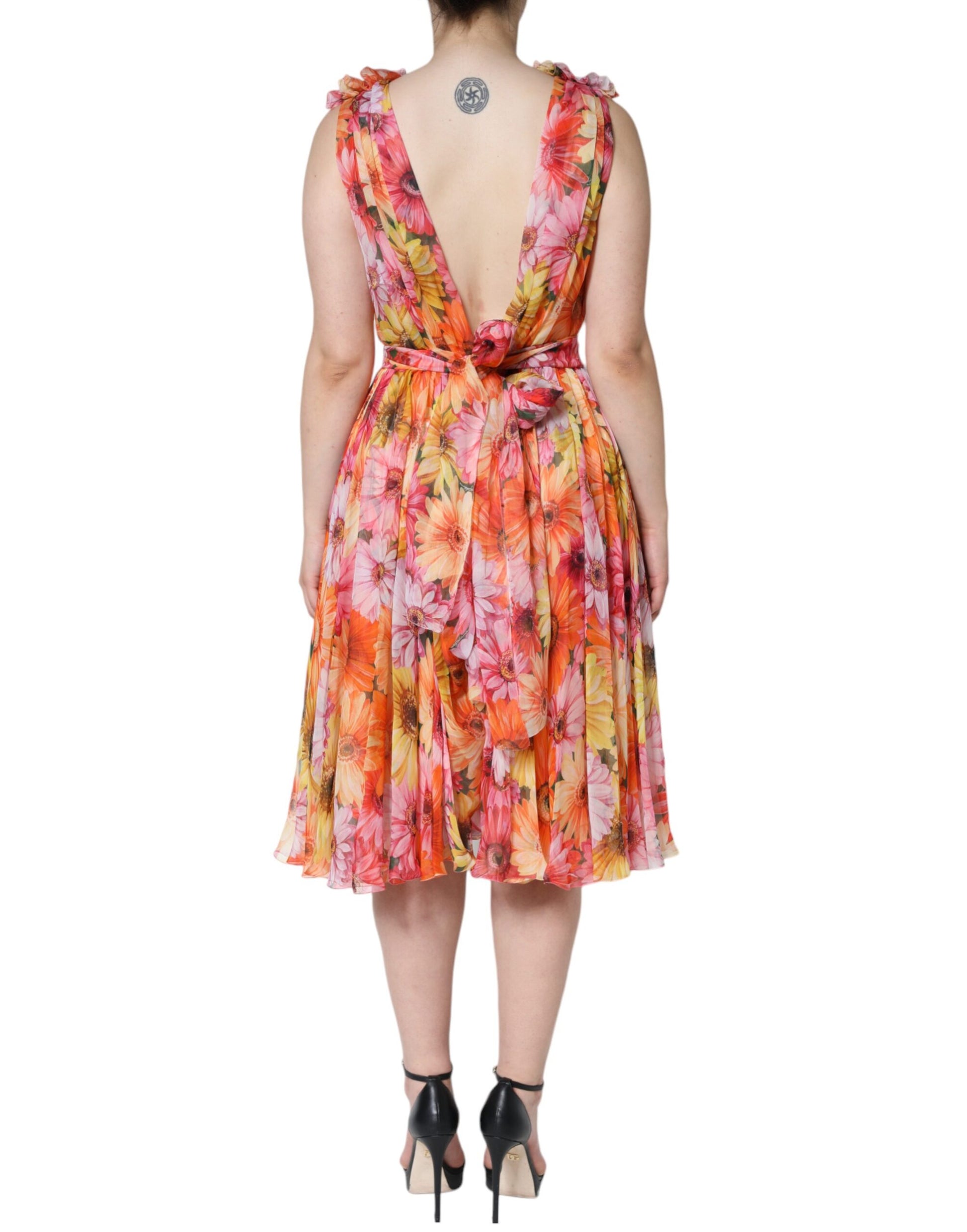 A sleeveless midi dress with a floral pattern and v-neck