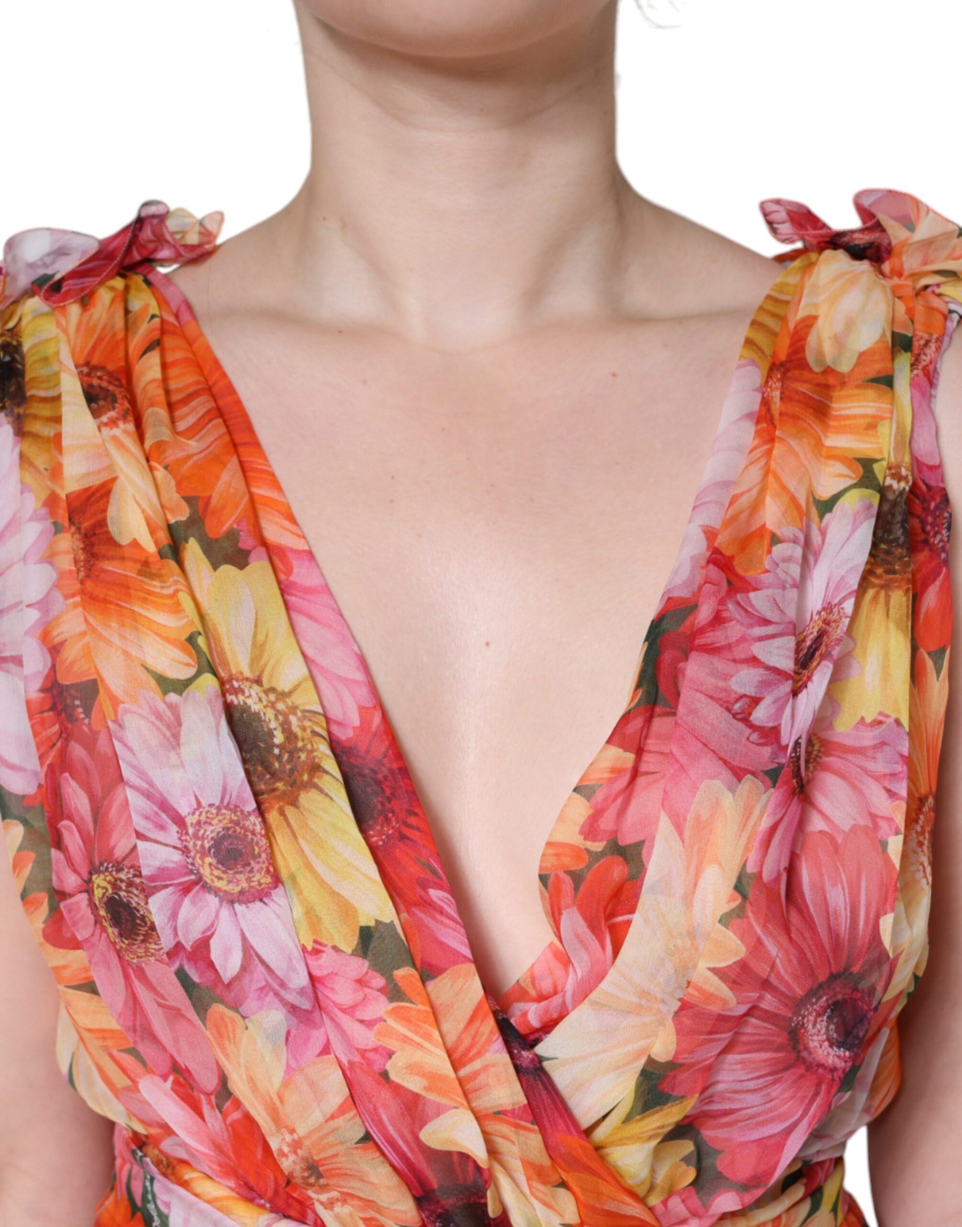 A sleeveless midi dress with a floral pattern
