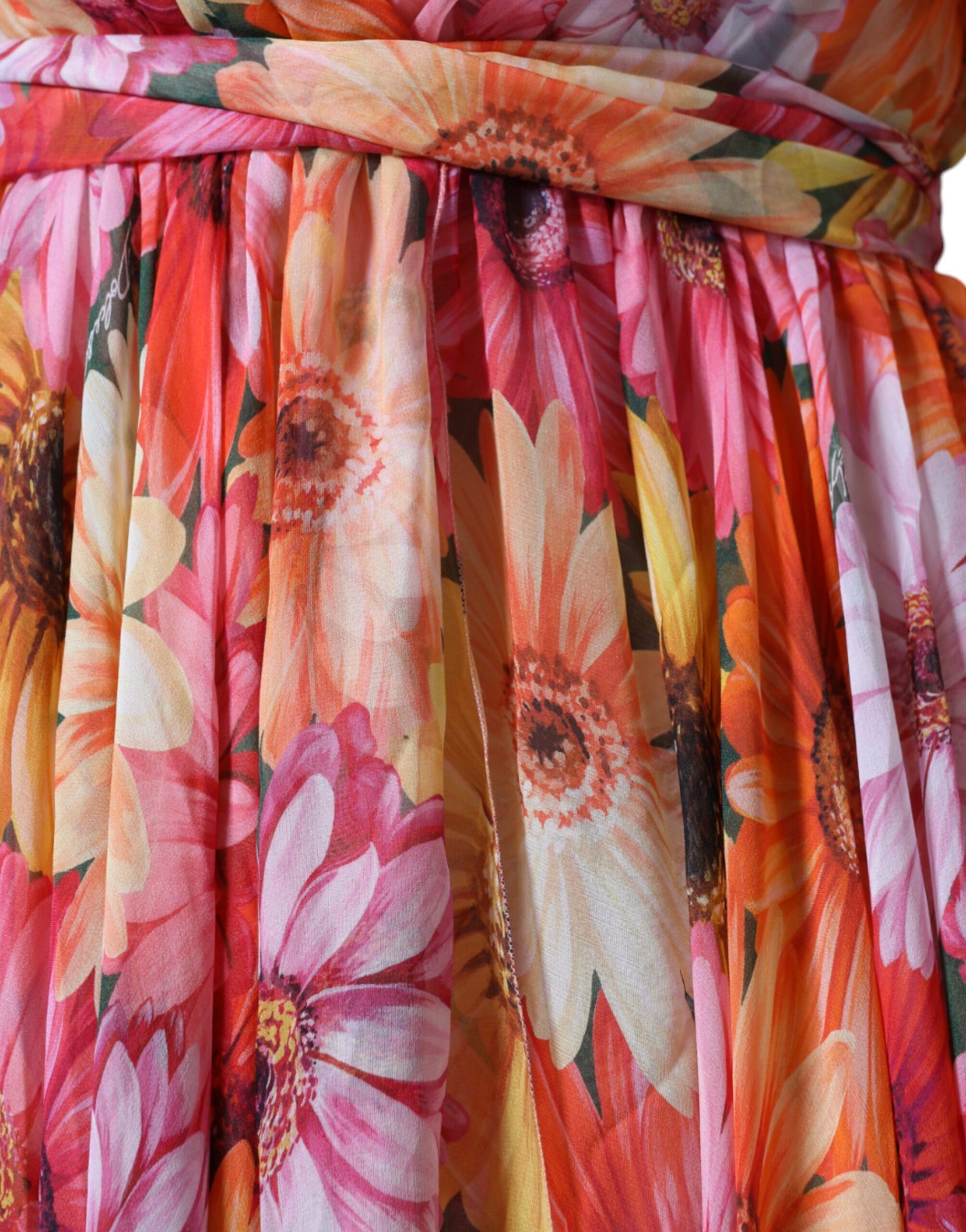 A sleeveless midi dress with a floral pattern