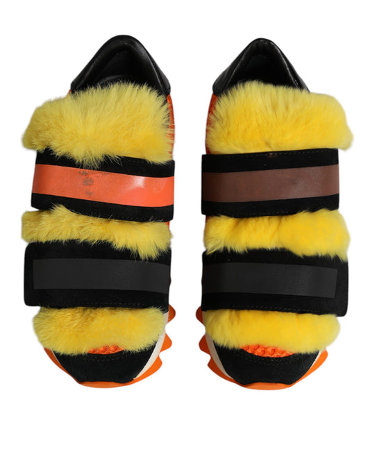 Pair of multicolored fur-embellished sneakers with black, red, and yellow stripes