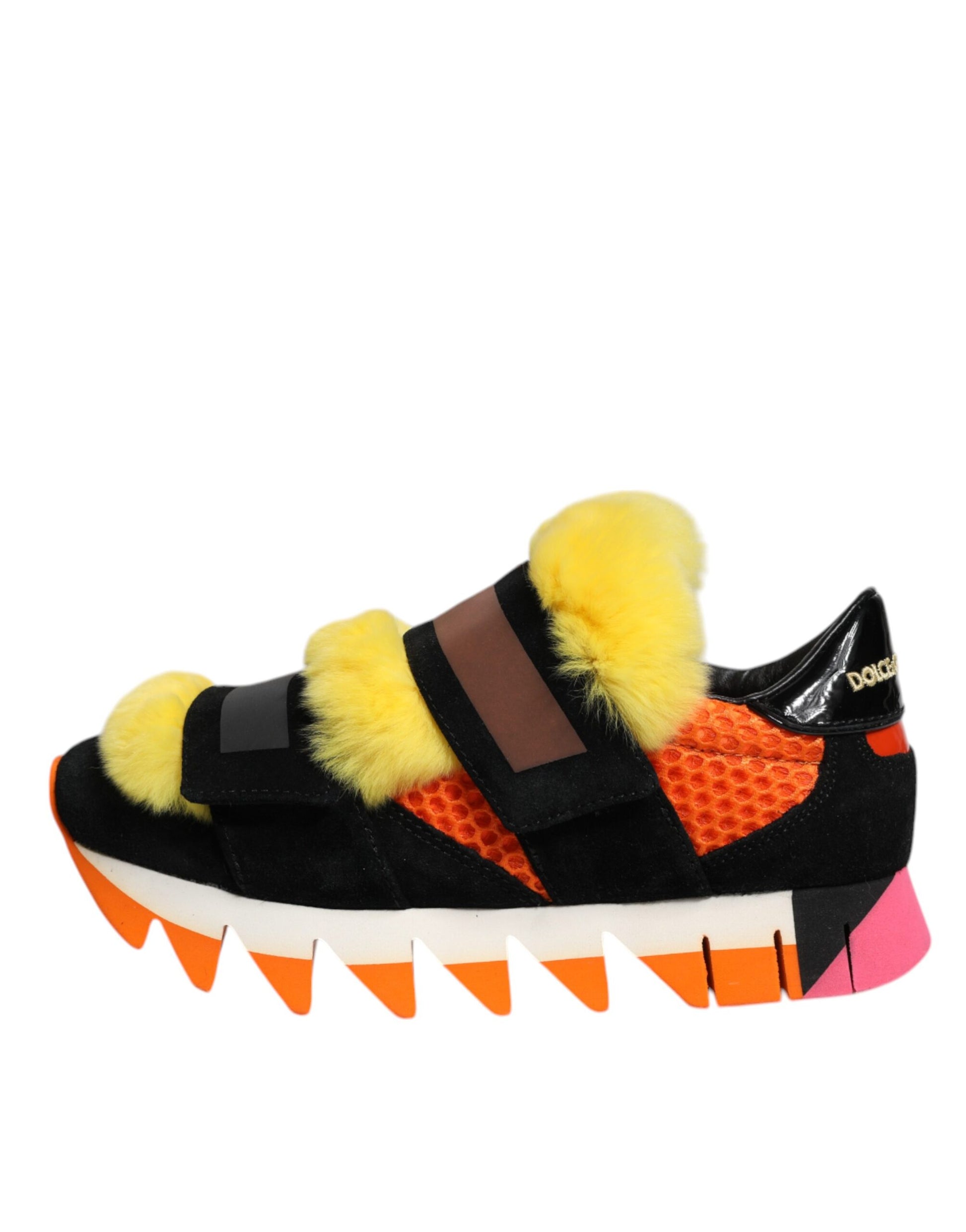 A pair of multicolored fur-embellished sneakers with a black, red, and yellow design