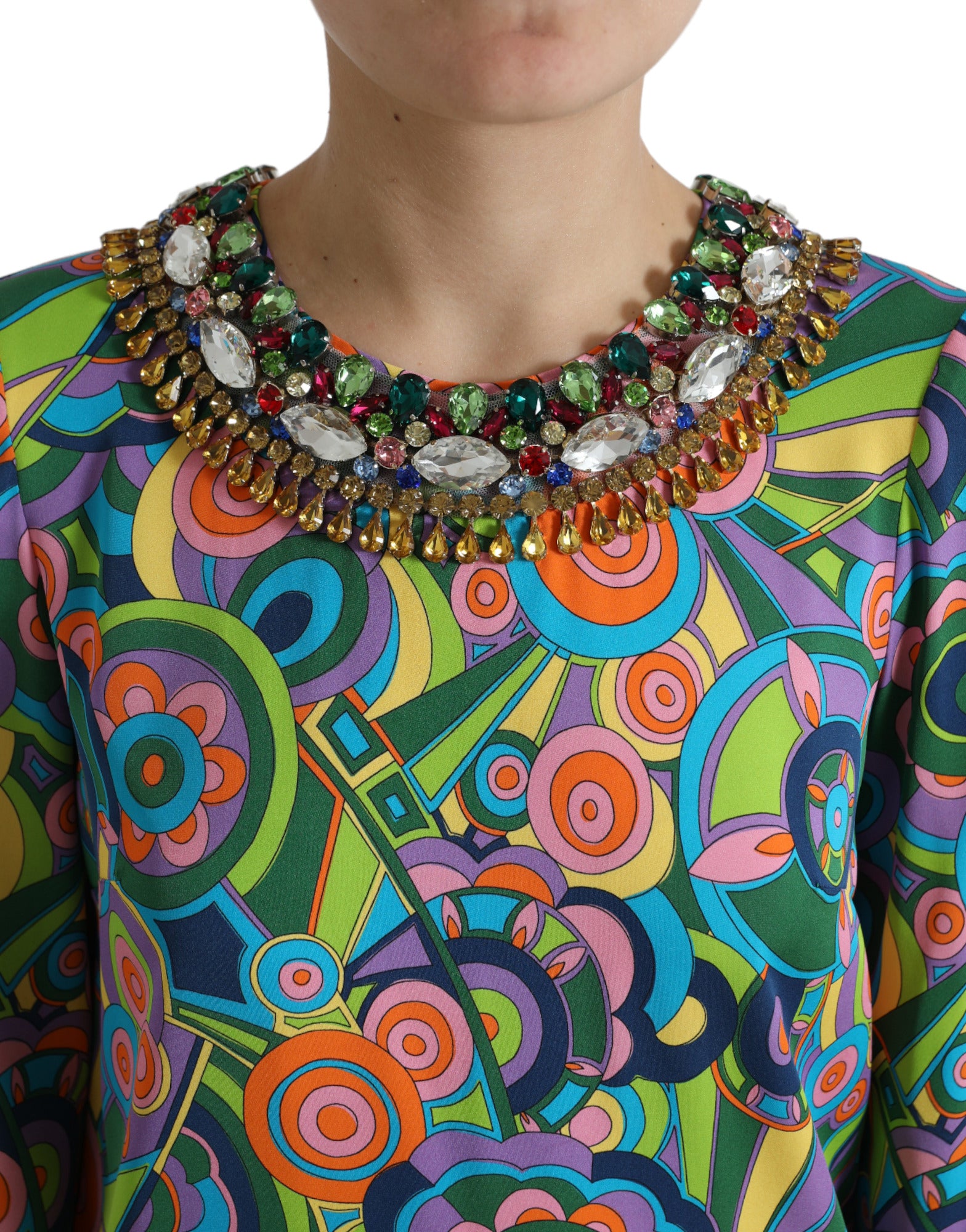 A colorful midi dress with a geometric print and crystal embellishments