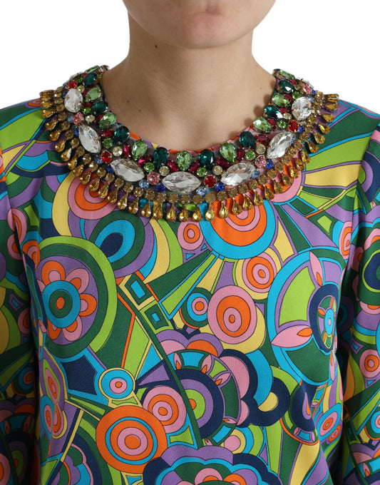A colorful midi dress with a geometric print and crystal embellishments