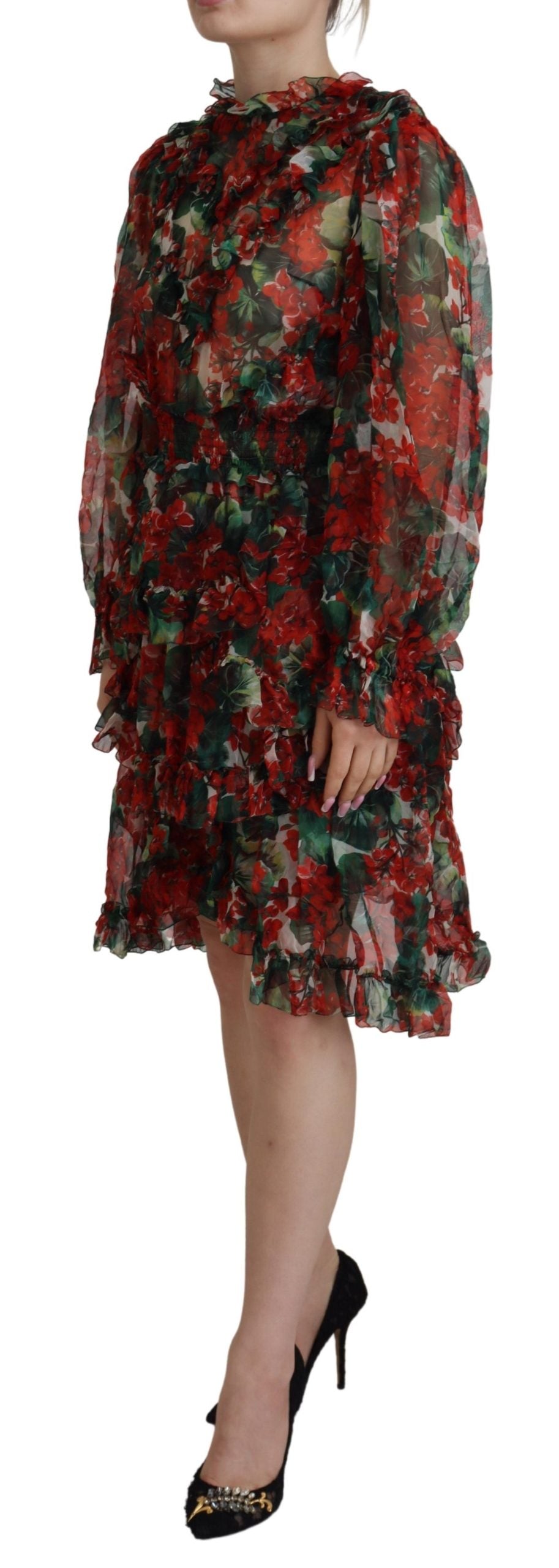 A woman wearing a floral patterned dress with long sleeves