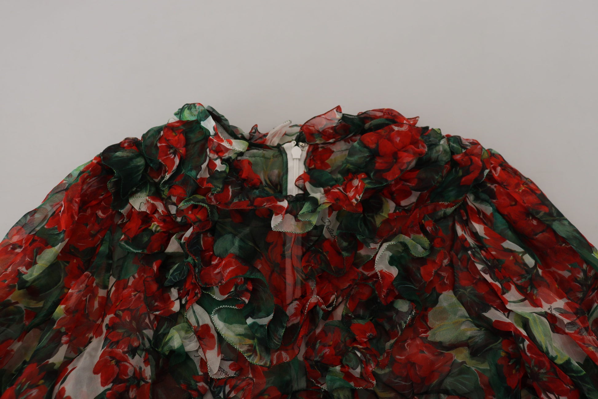 A colorful dress with a floral pattern and a knee length