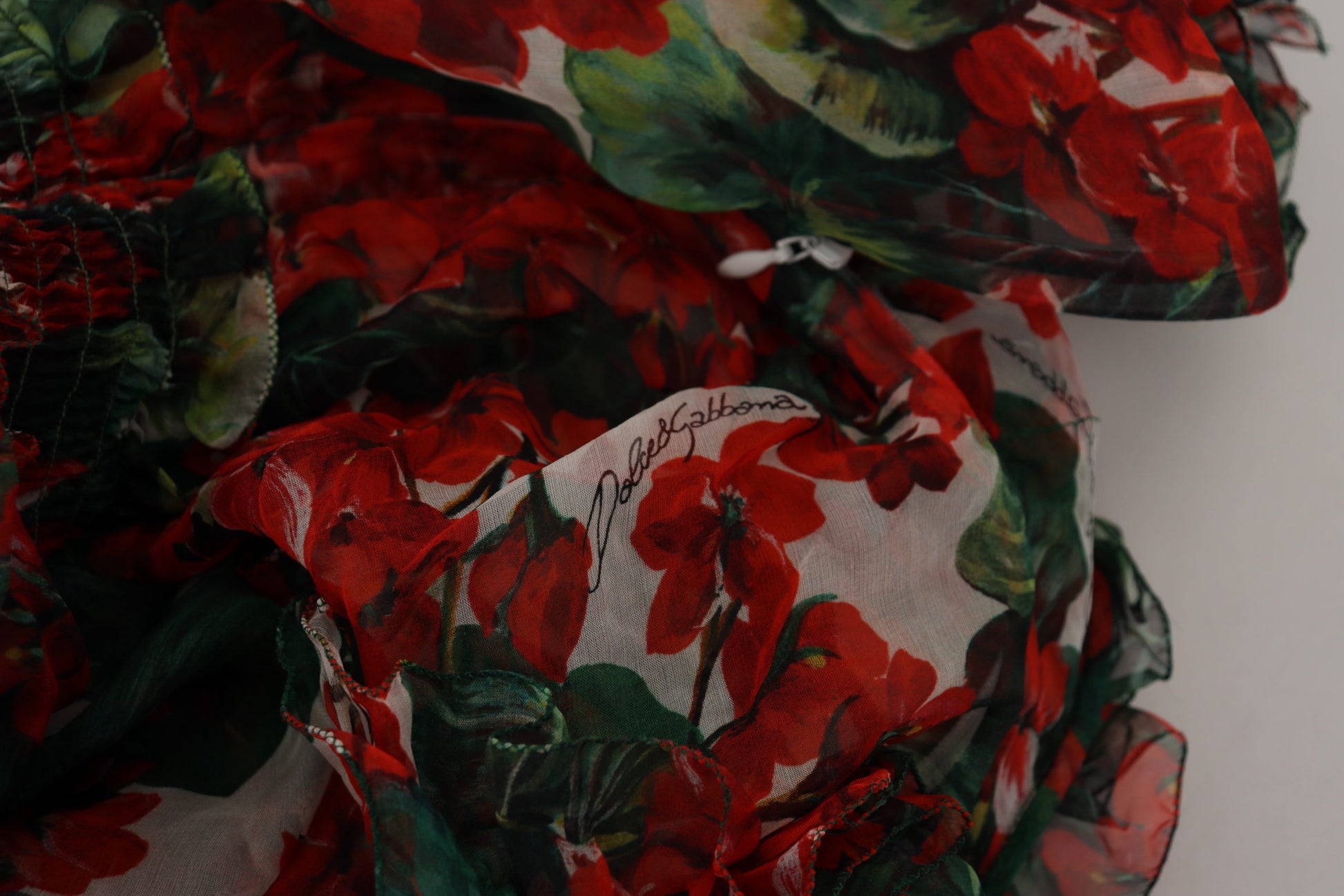 A colorful dress with a floral pattern and ruffled sleeves