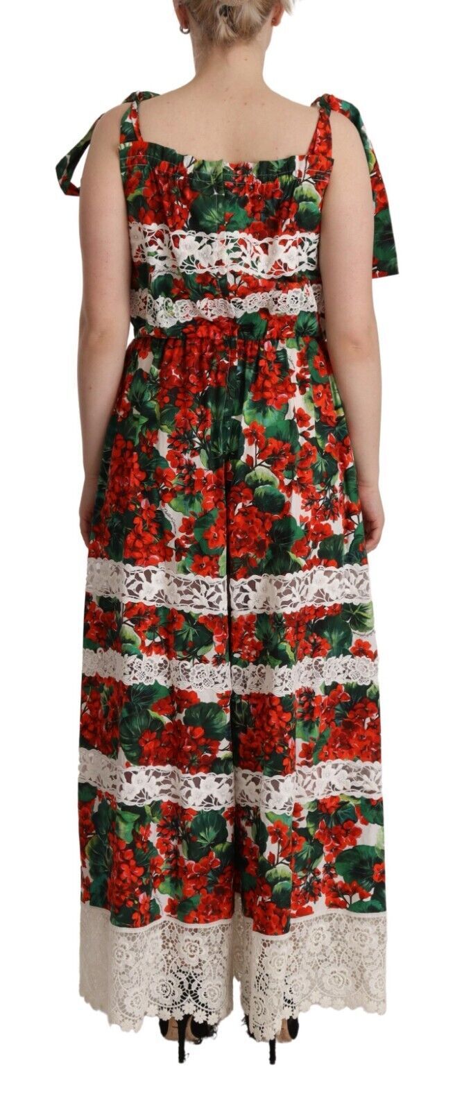 A long, multicolored dress with a geranium print and lace detailing