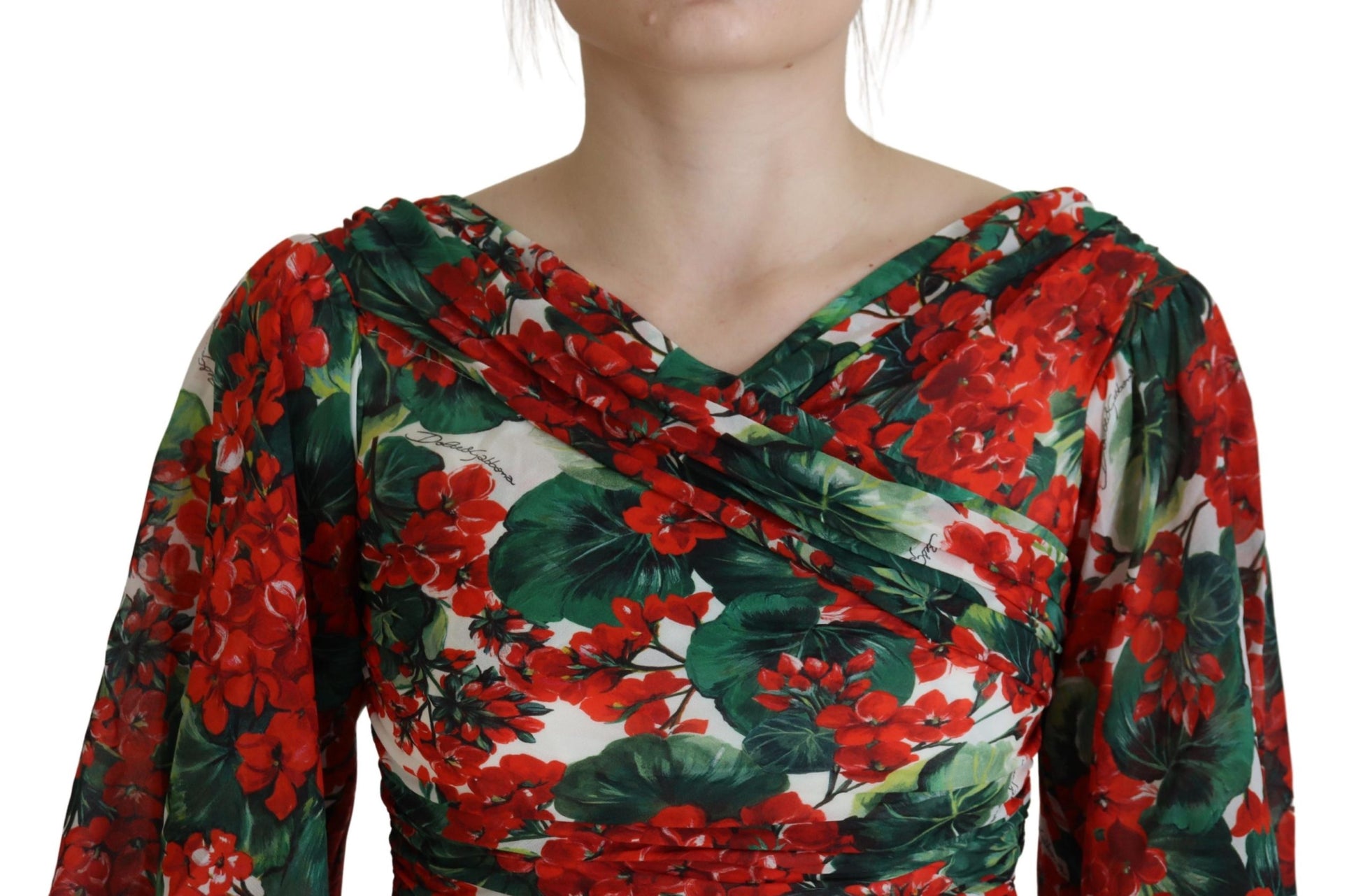 A red, green, and white floral print midi dress with a V-neckline