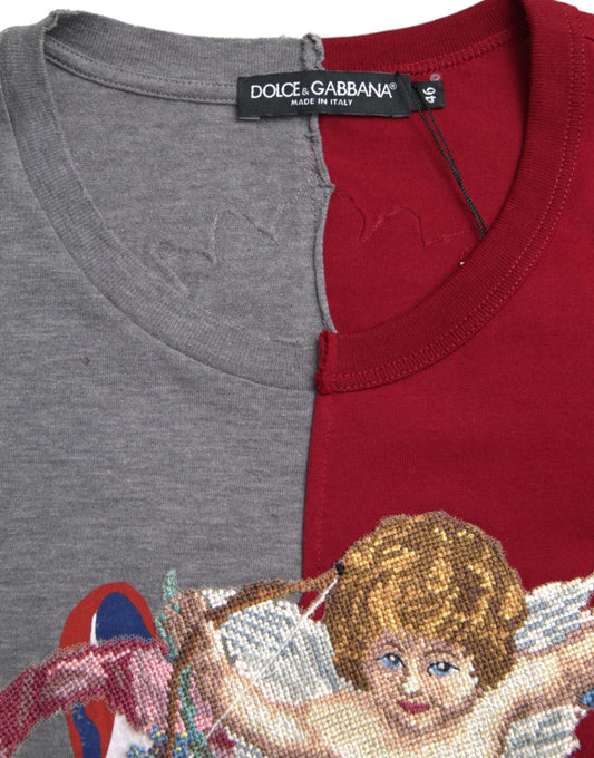 Two shirts on hangers, one gray and one red, with a cross stitched angel design