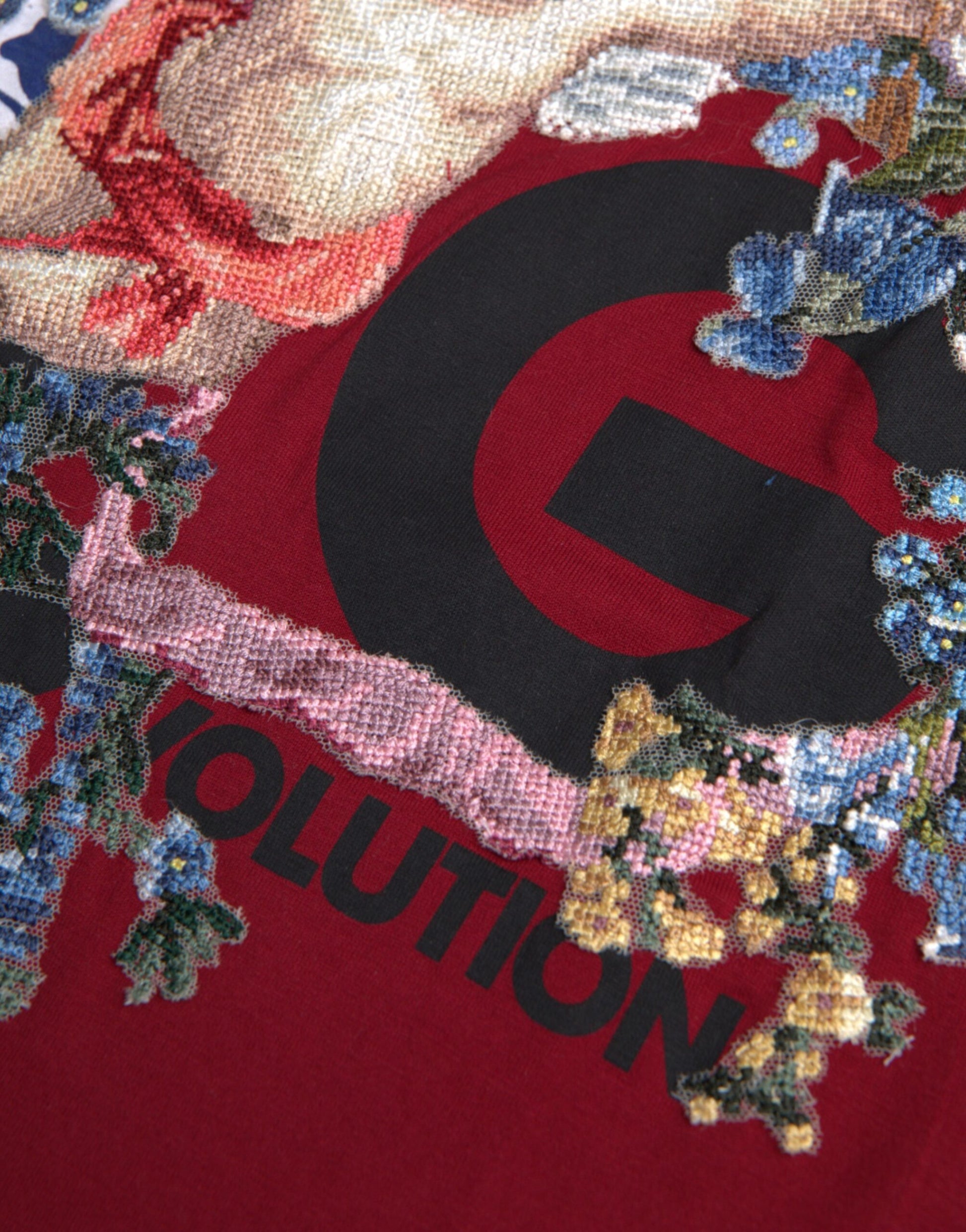 Red sweater with embroidered floral design and Gucci logo