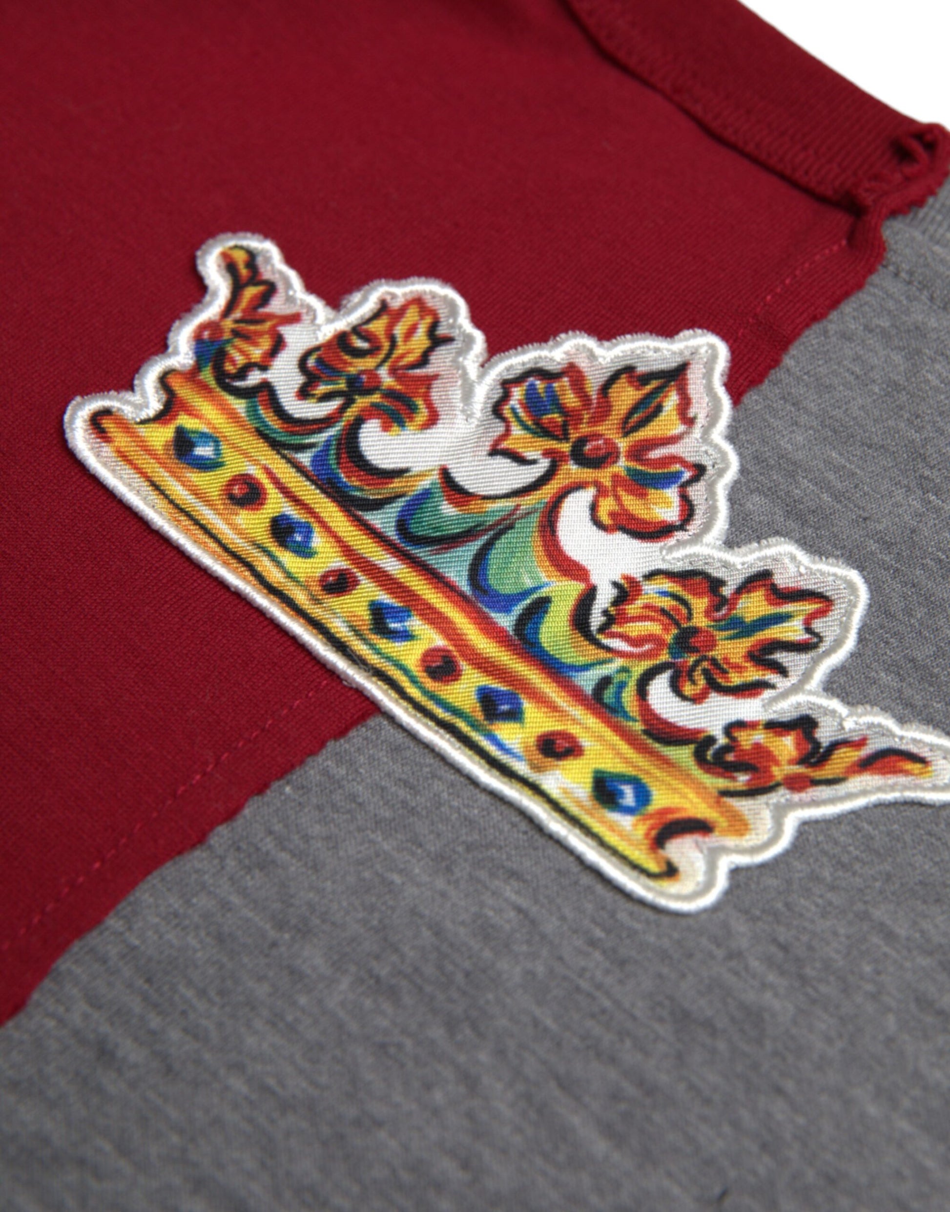 Embroidered crown on a gray shirt