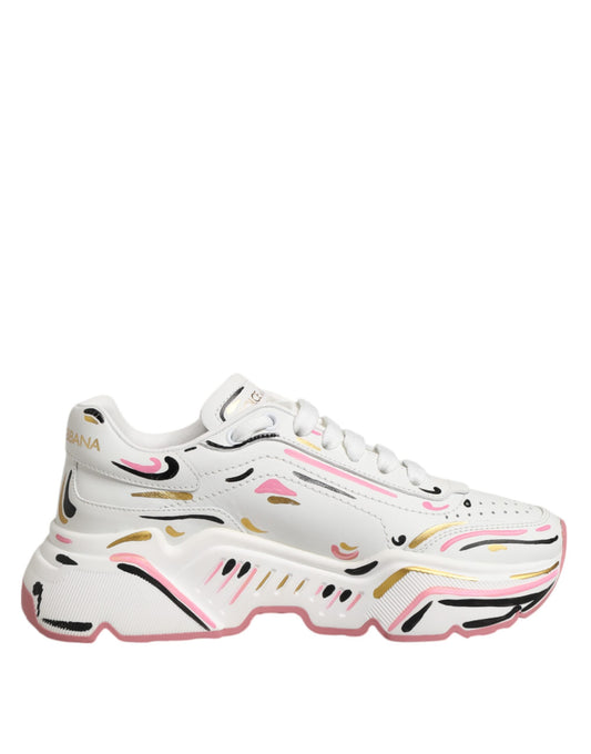 White sneakers with pink and gold hand-painted design