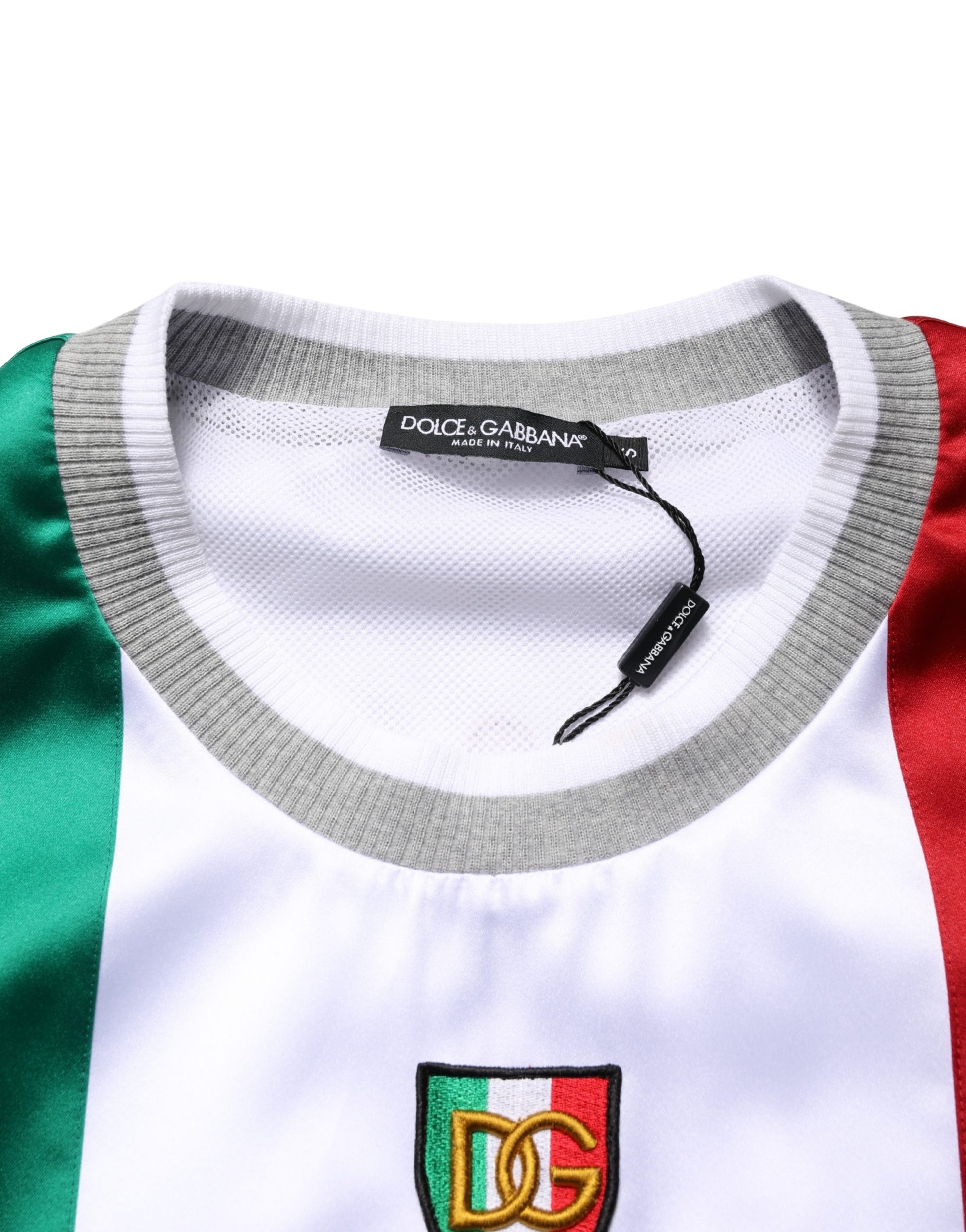 The shirt is white with red and green stripes
