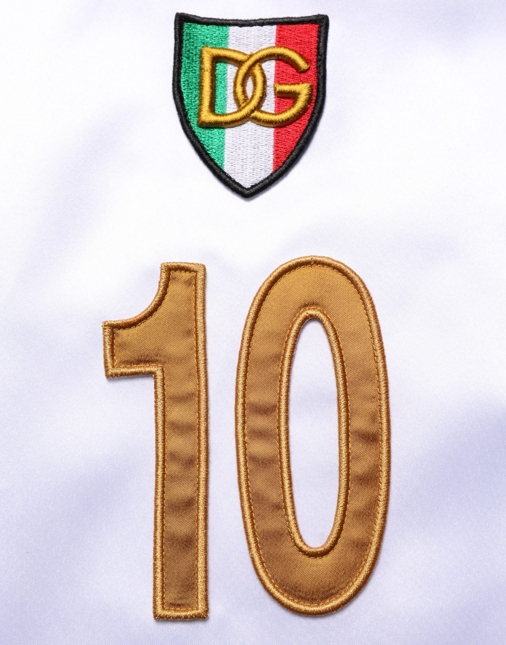 White soccer jersey with gold number 10