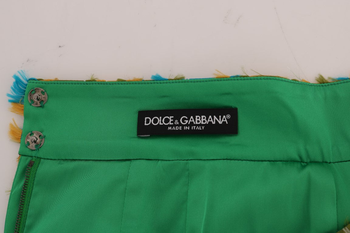 Green bag with black label reading "Dolce & Gabbana"
