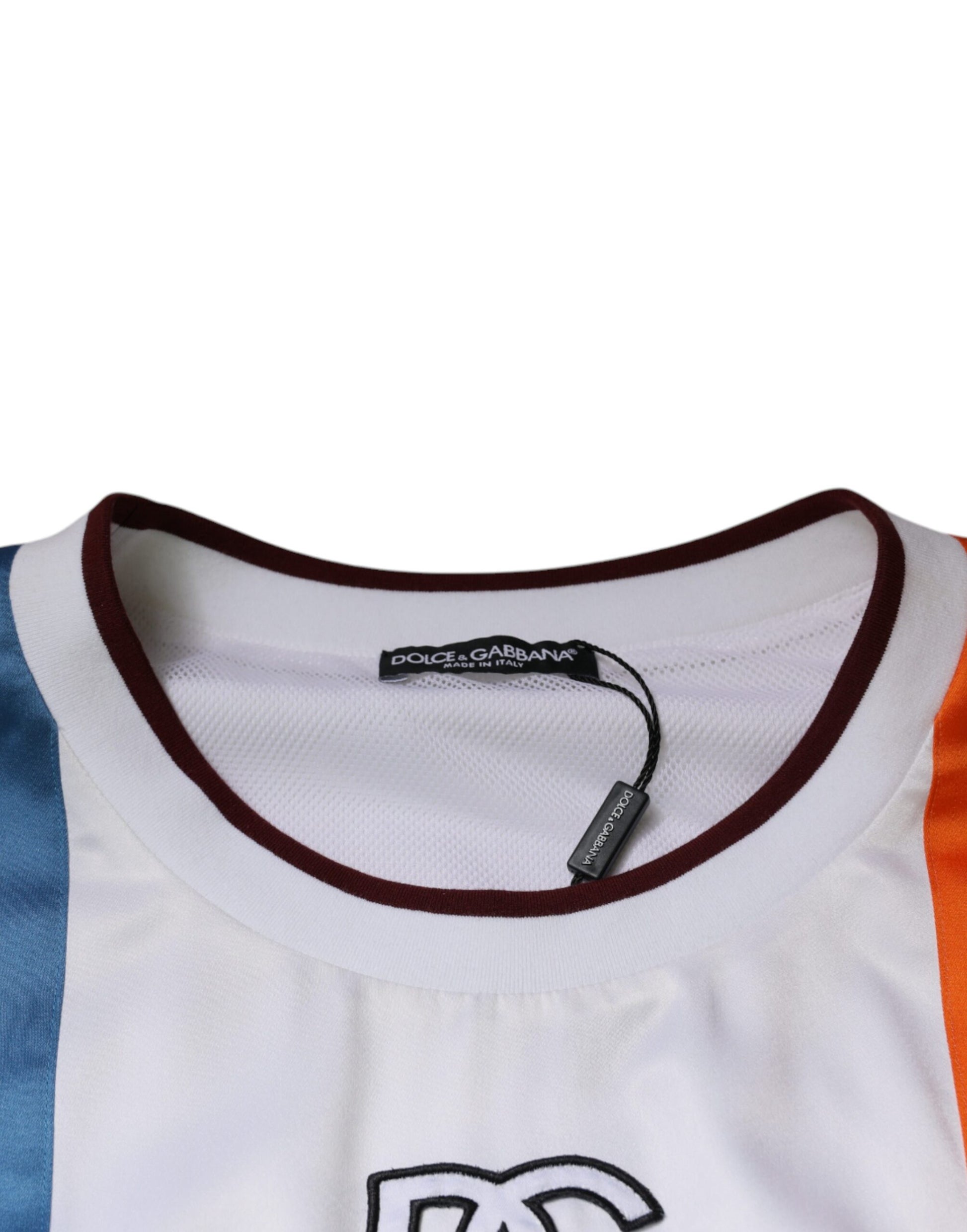 White shirt with orange and blue stripes on sleeves