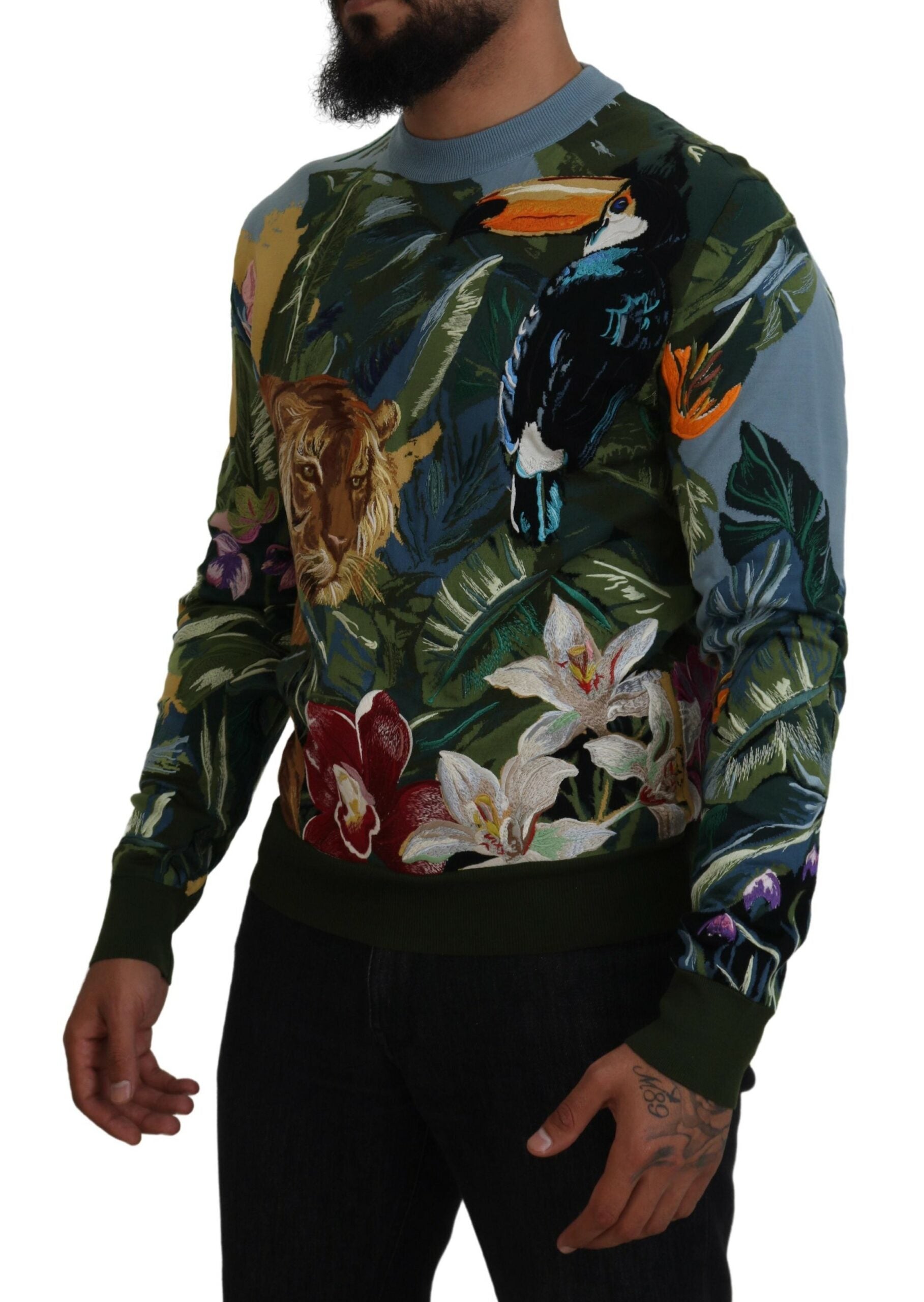 Man wearing a colorful sweater with floral and animal prints