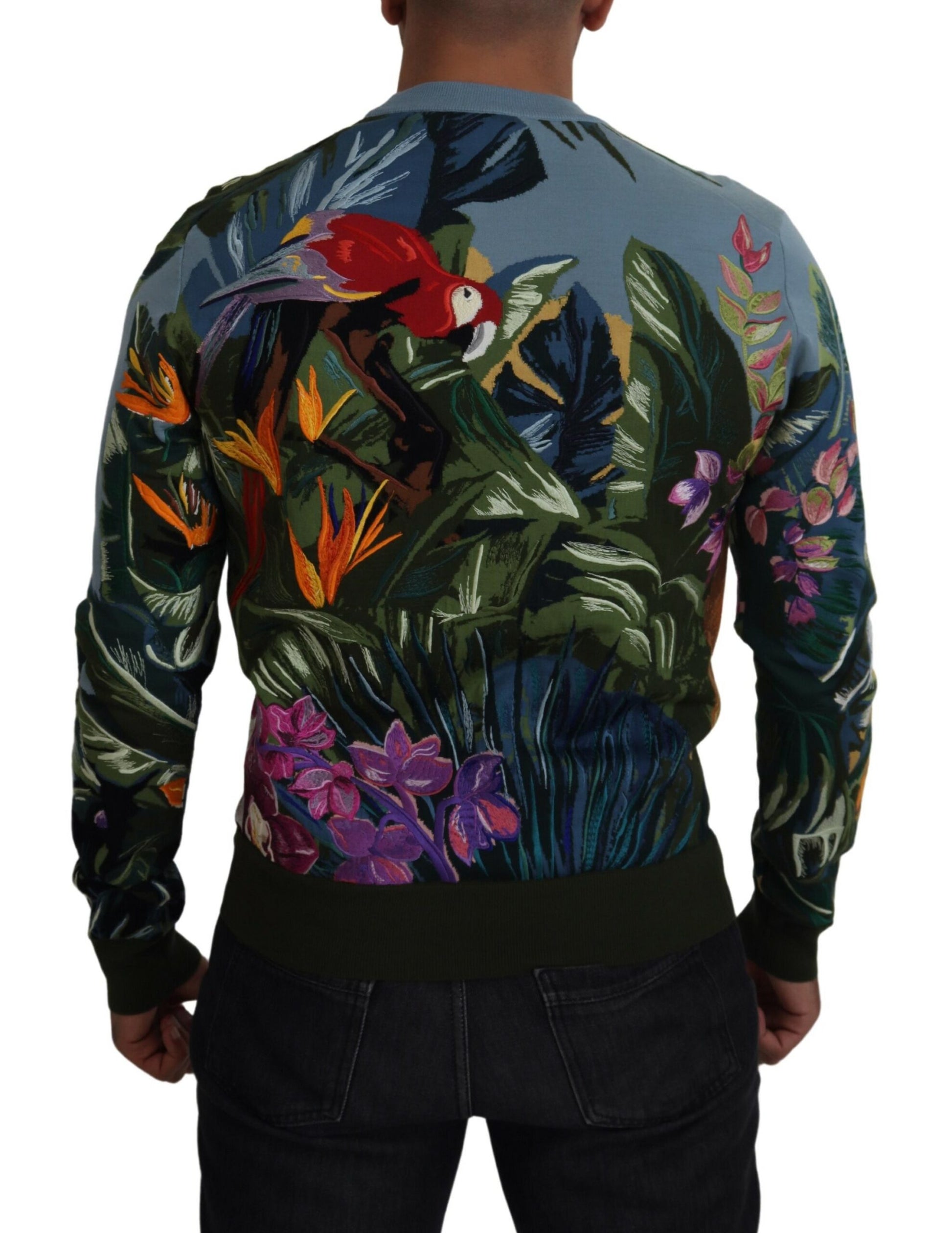 Man wearing a sweater with floral pattern on back