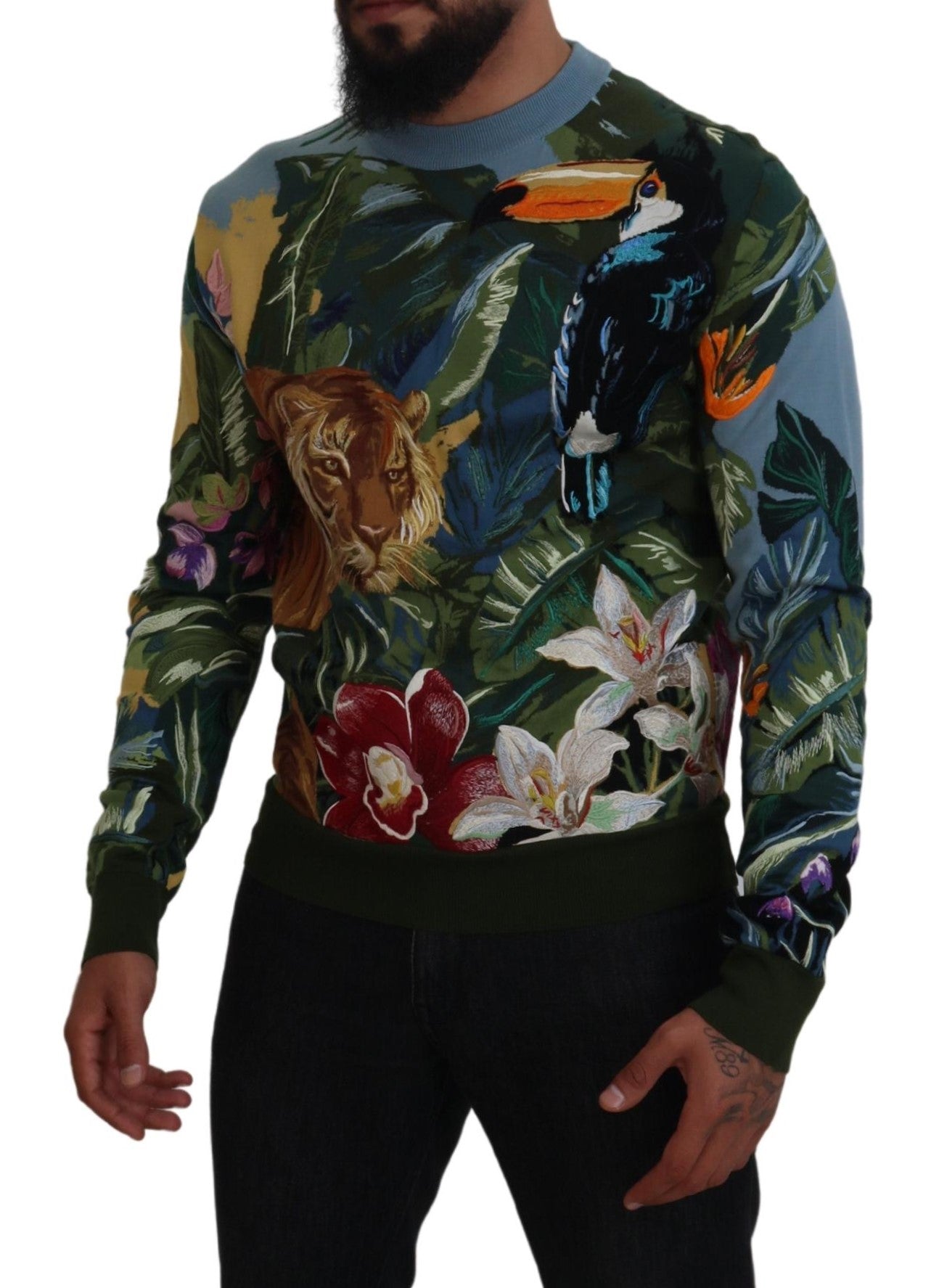 Man wearing colorful sweater with tropical birds and flowers
