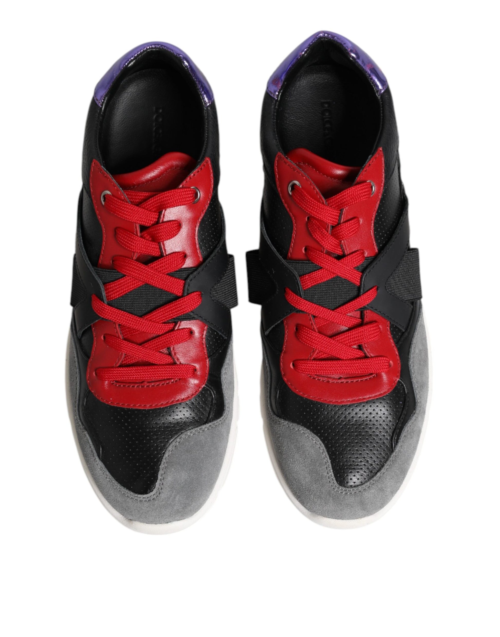 Pair of black and red sneakers with white soles
