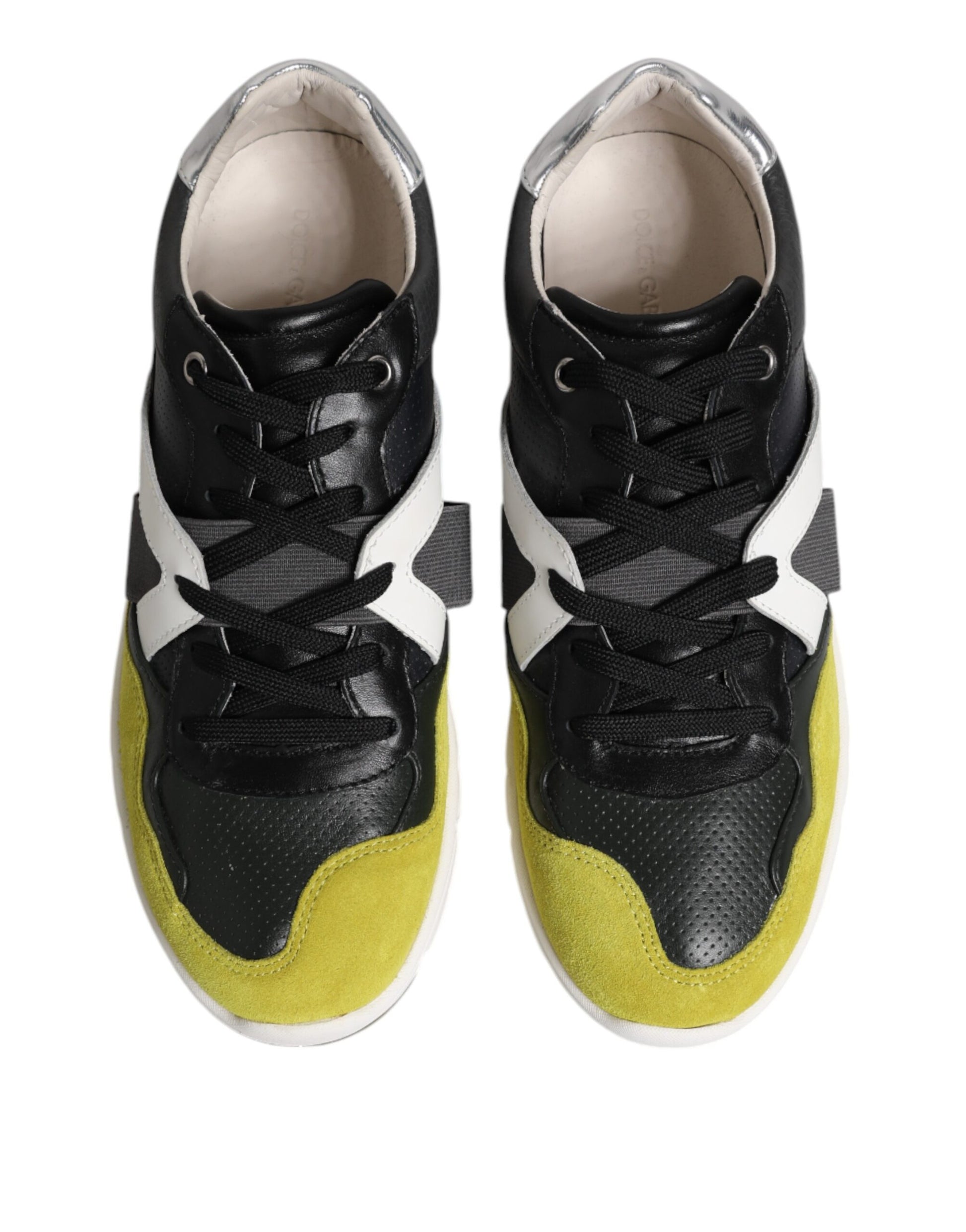 Pair of black and yellow sneakers with white stripes