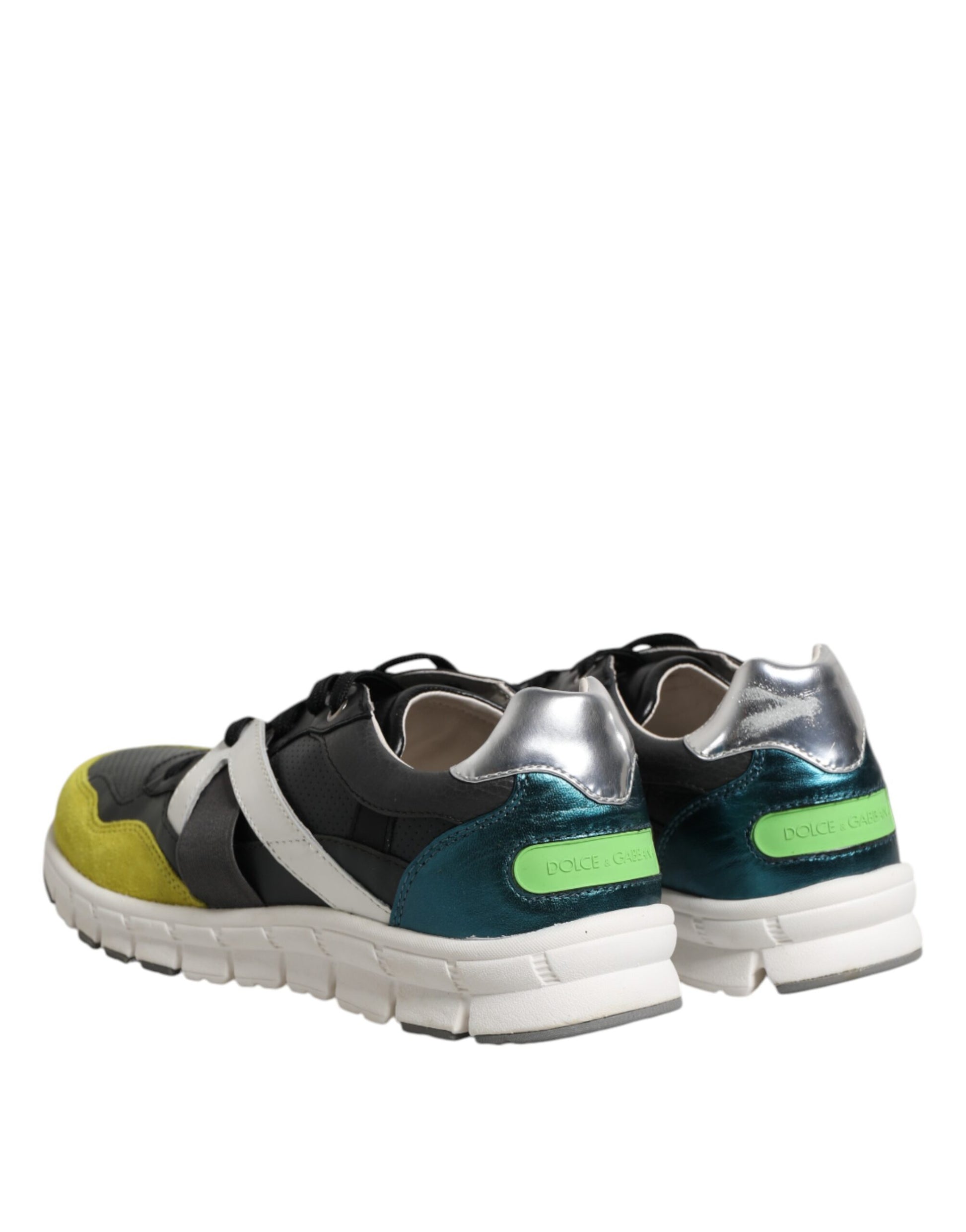 Pair of sneakers with white soles and black laces