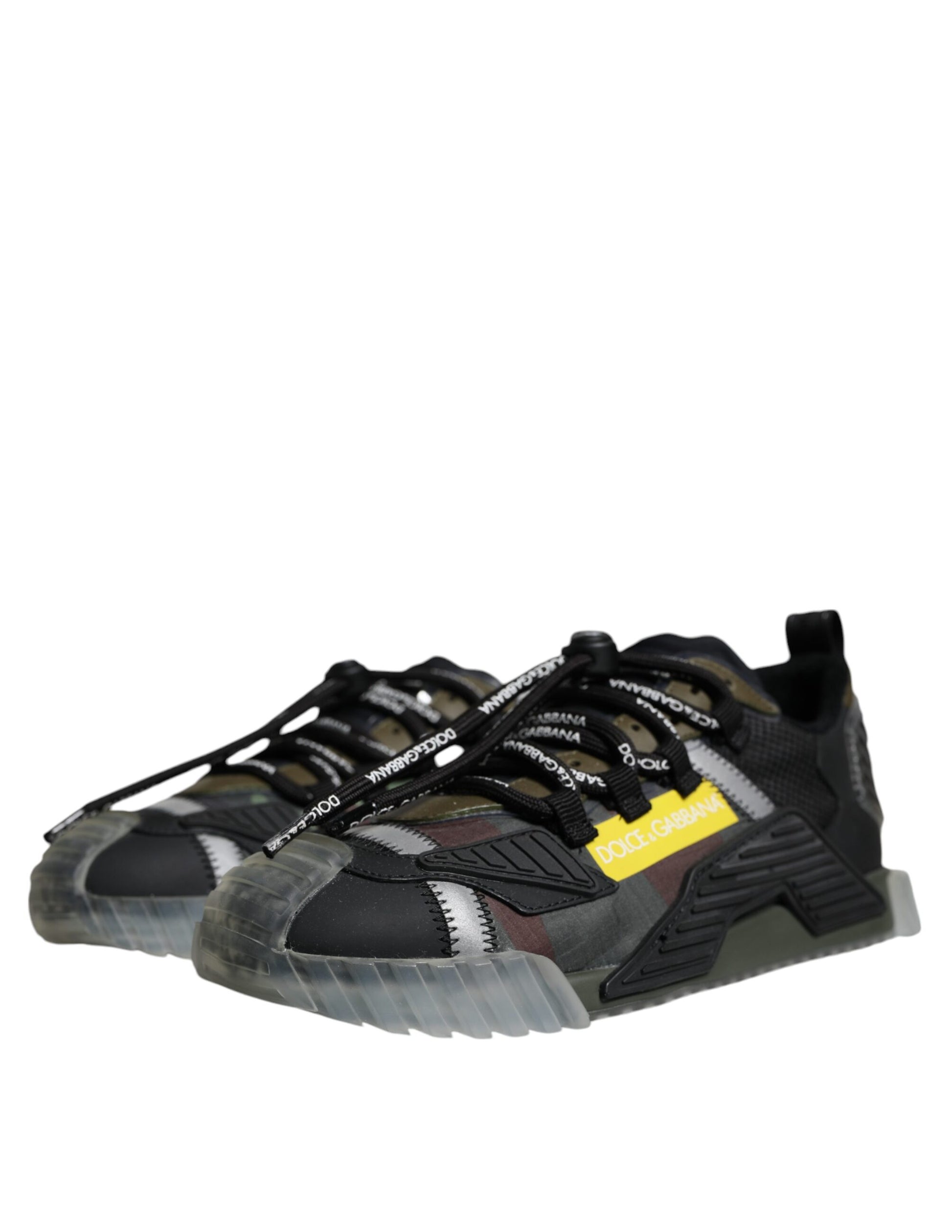 A pair of black, white, and yellow lace-up sneakers with a low top
