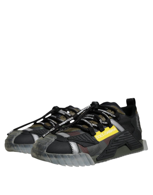 A pair of black, white, and yellow lace-up sneakers with a low top