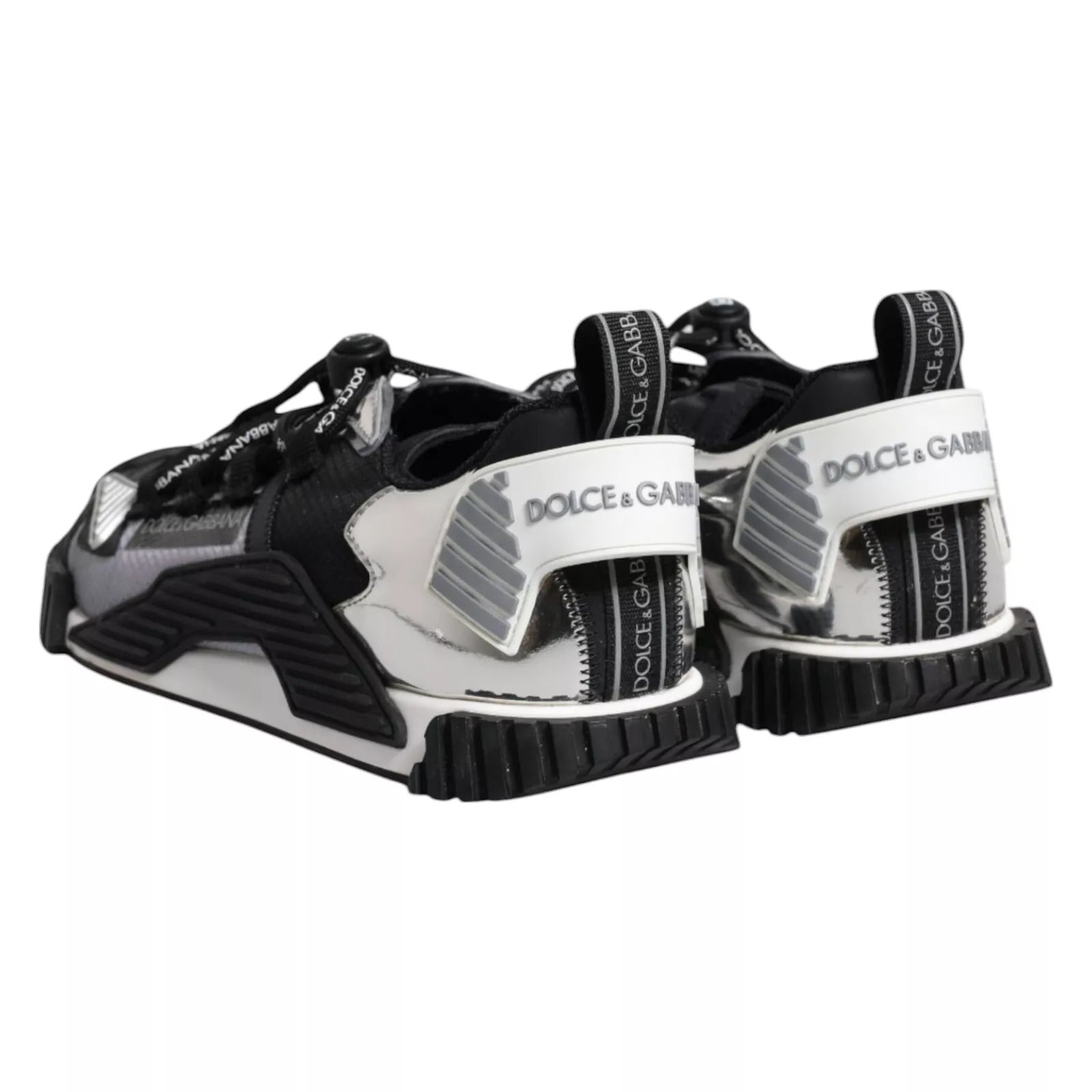 Pair of black and white sneakers with brand logo on side