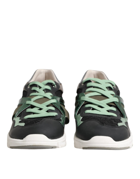 Pair of black sneakers with green laces