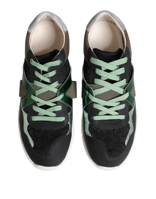 Pair of black sneakers with green laces