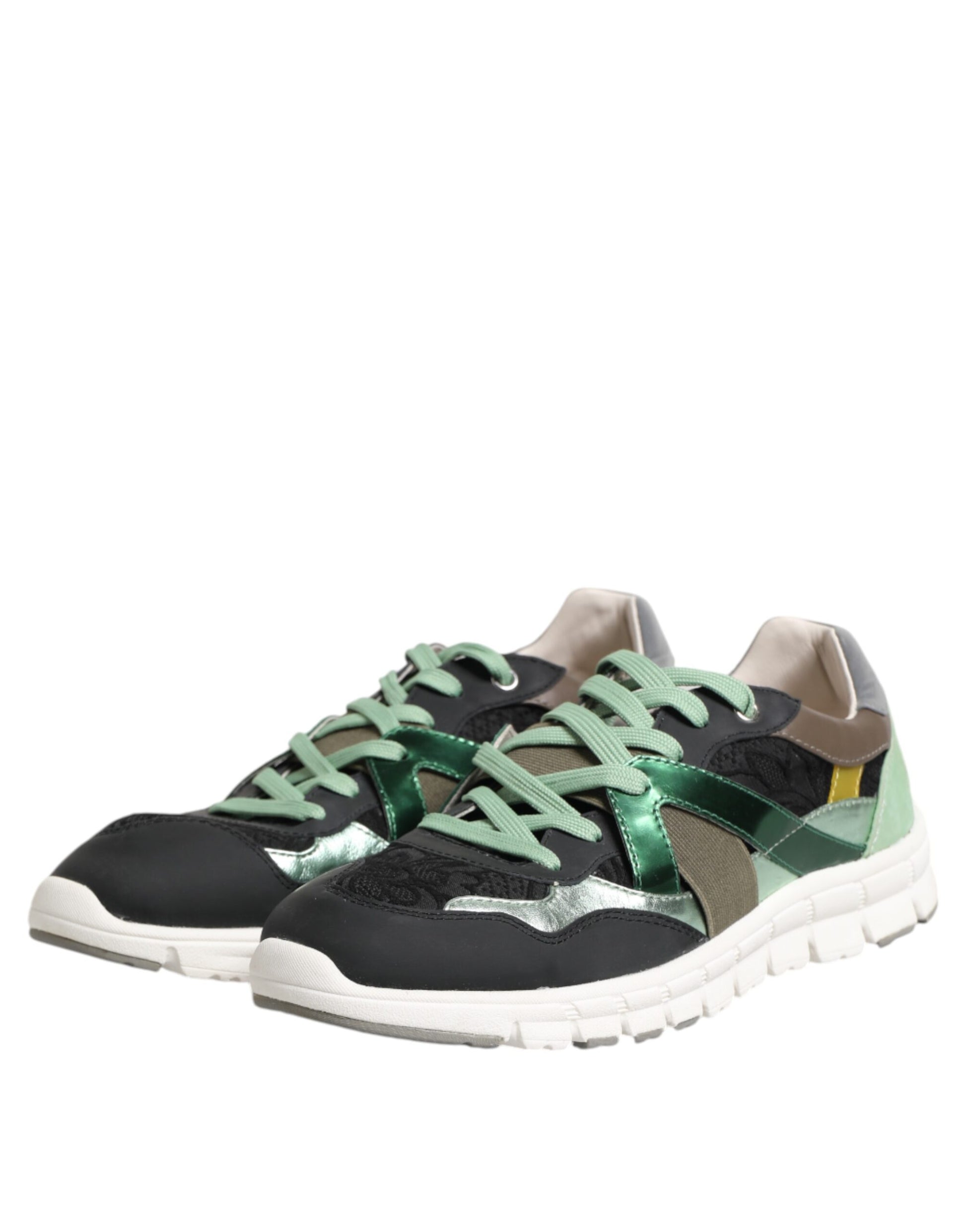 Pair of black sneakers with green laces and a white sole