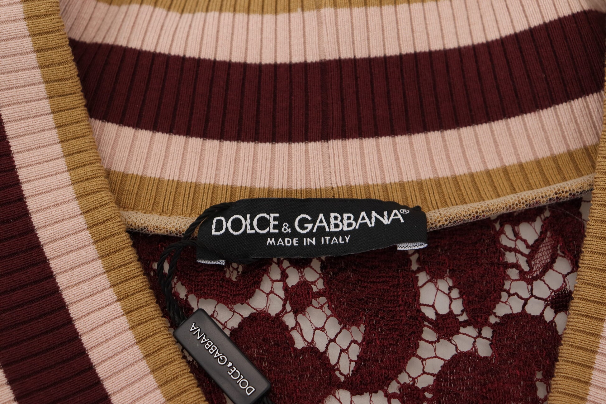 The tag on a sweater reads "D&G Dolce & Gabbana Made in Italy"