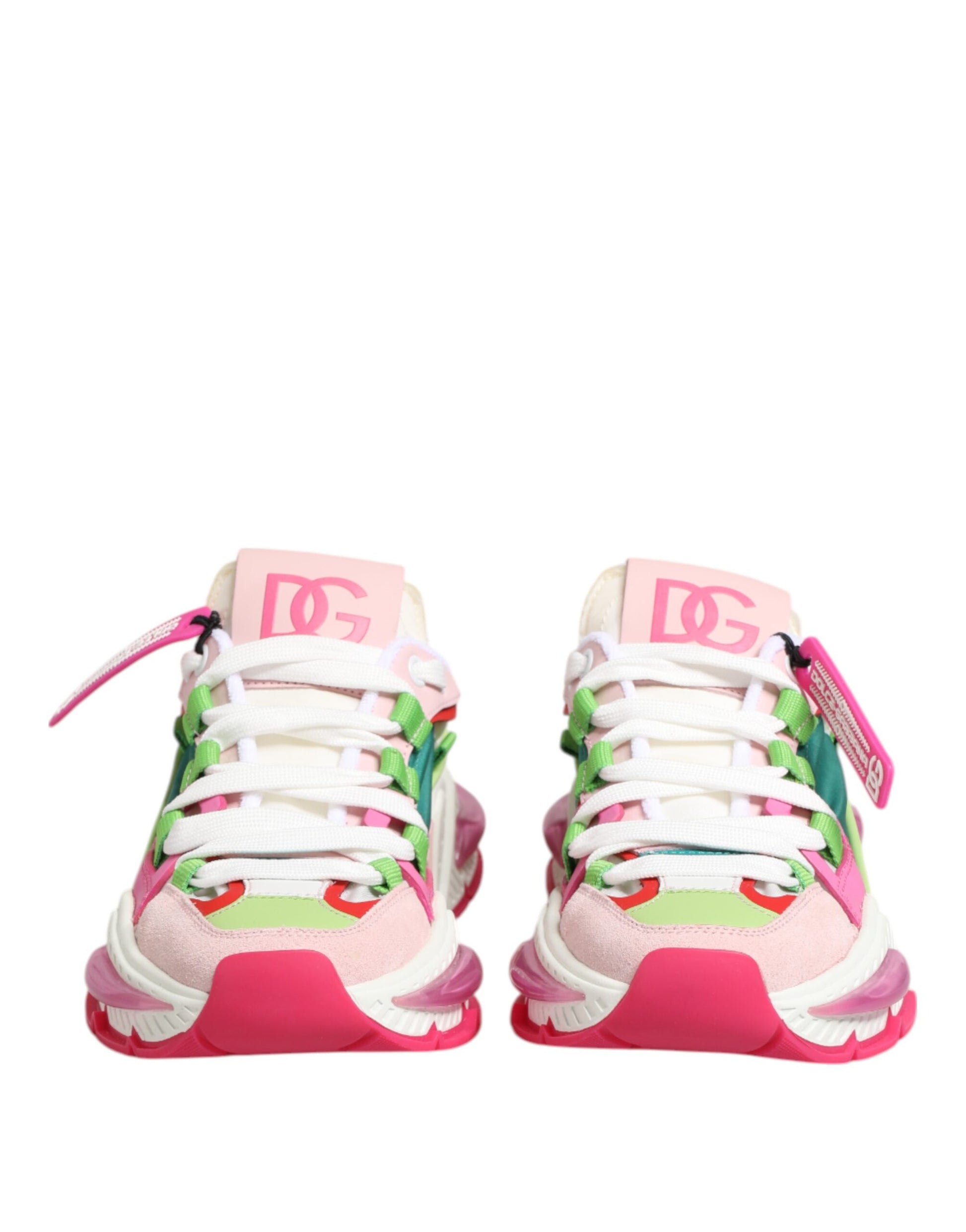 Pink, white, and green leather sneakers with multicolored laces