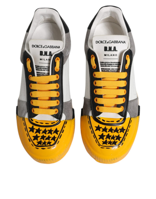 Pair of sneakers with yellow laces and stars on side