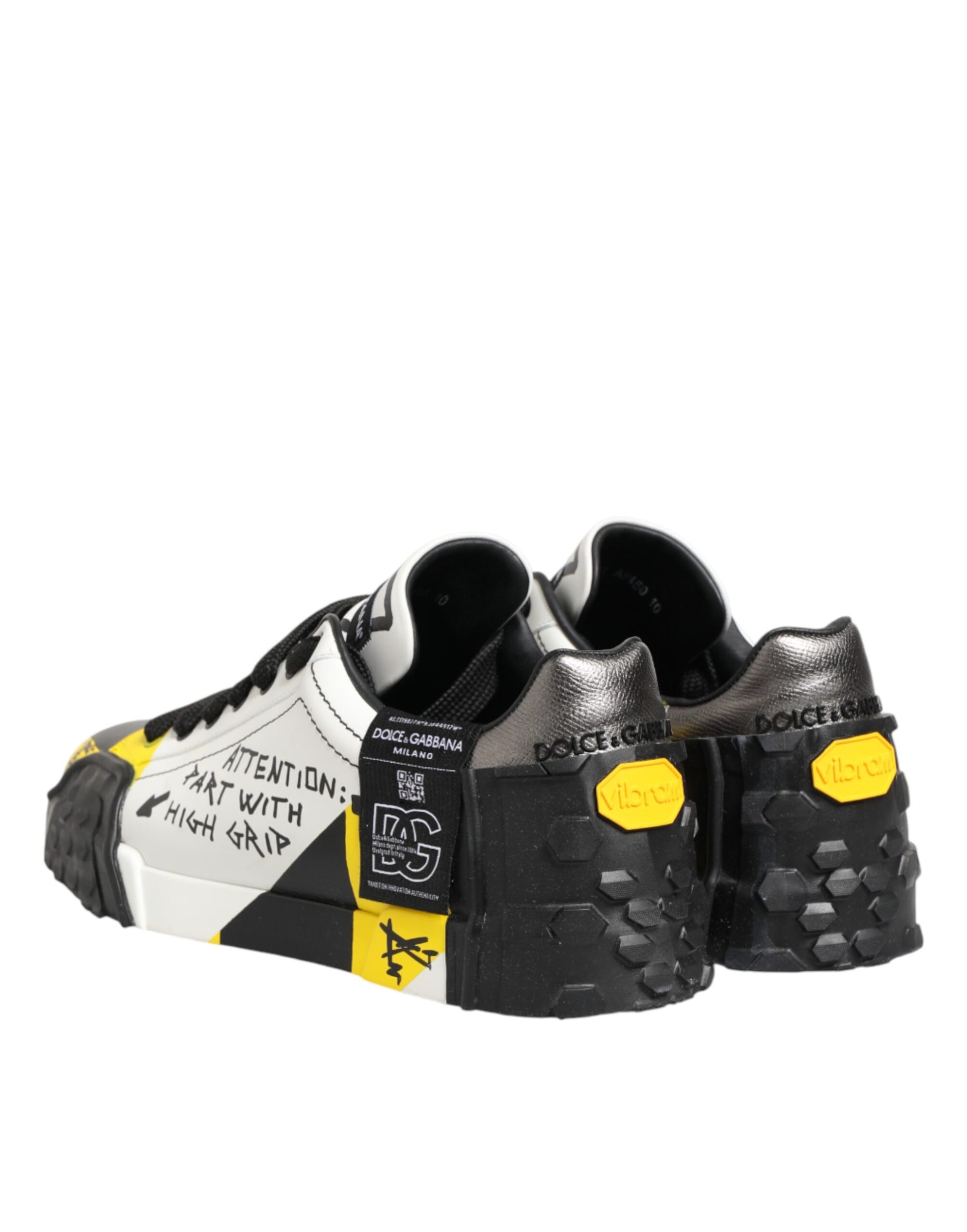 Pair of sneakers with yellow laces