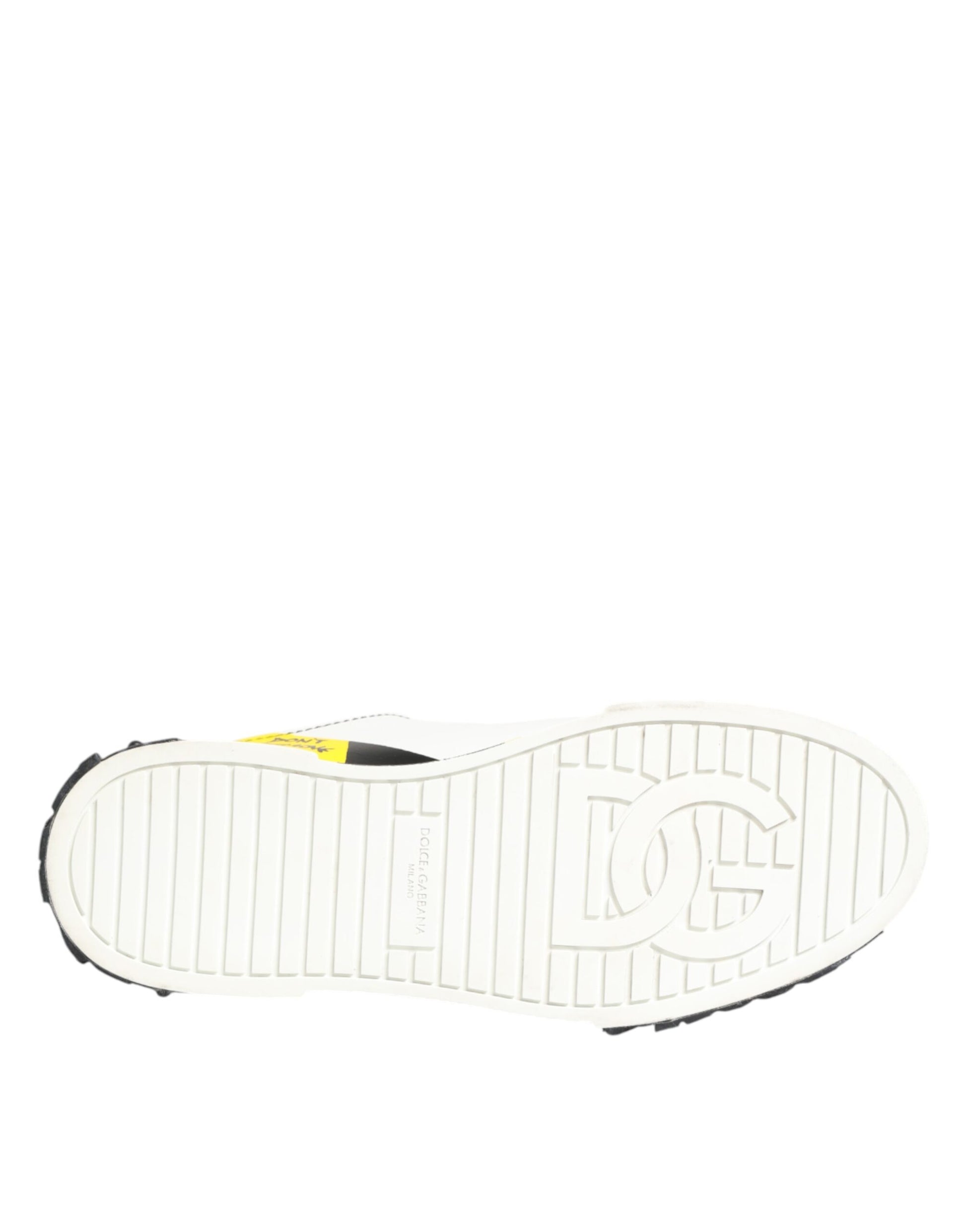 White sneaker with yellow logo on side