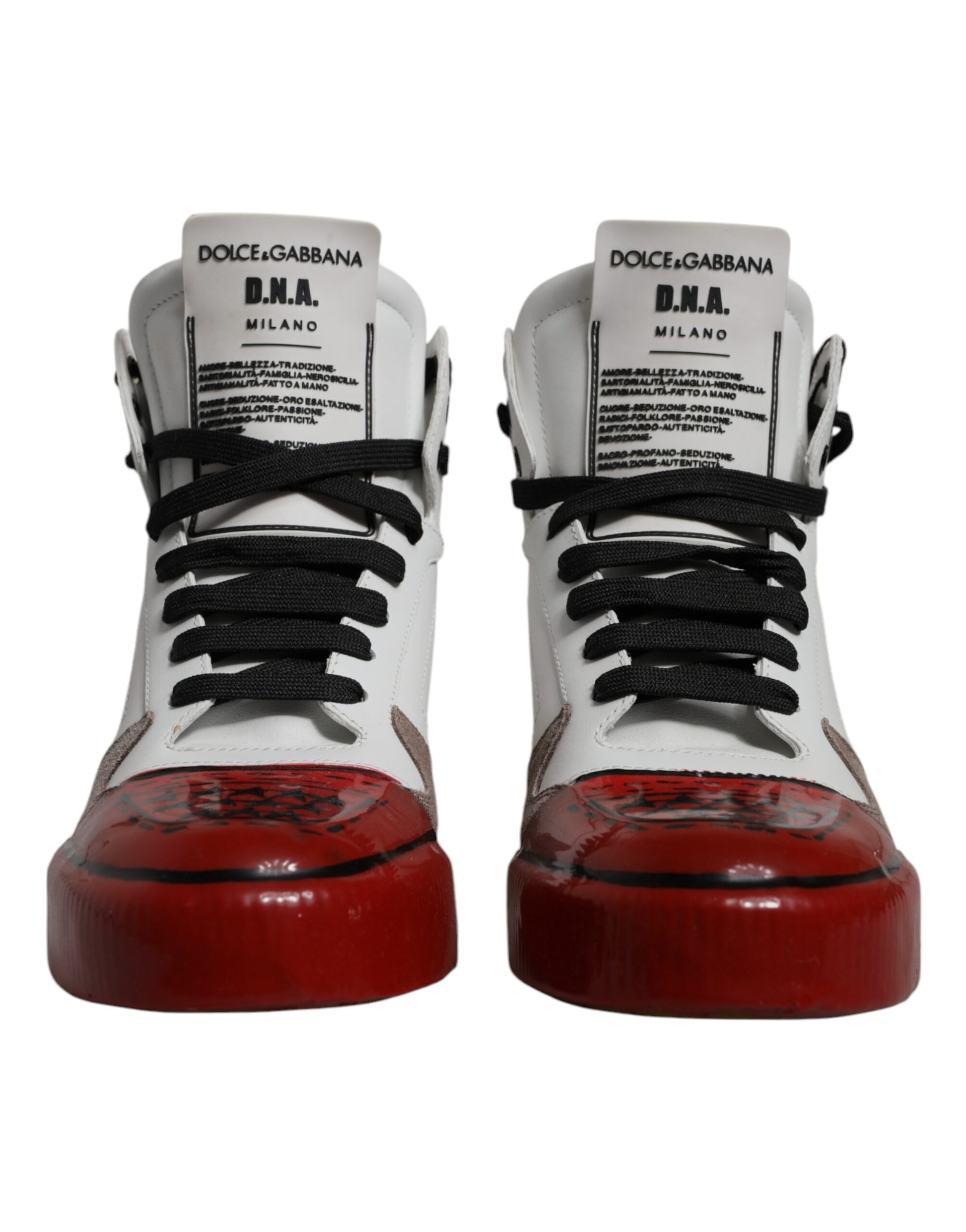 Pair of white and red sneakers with black laces and soles